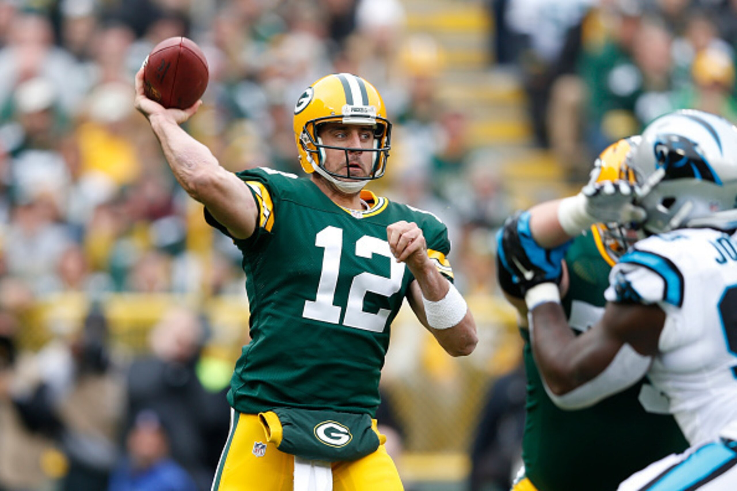 GREEN BAY, WI - OCTOBER 19: Aaron Rodgers #12 of the Green Bay Packers passes the ball in the first half of the game against the Carolina Panthers at Lambeau Field on October 19, 2014 in Green Bay, Wisconsin. (Photo by Joe Robbins/Getty Images) GREEN BAY, WI - OCTOBER 19: Aaron Rodgers #12 of the Green Bay Packers passes the ball in the first half of the game against the Carolina Panthers at Lambeau Field on October 19, 2014 in Green Bay, Wisconsin. (Photo by Joe Robbins/Getty Images)