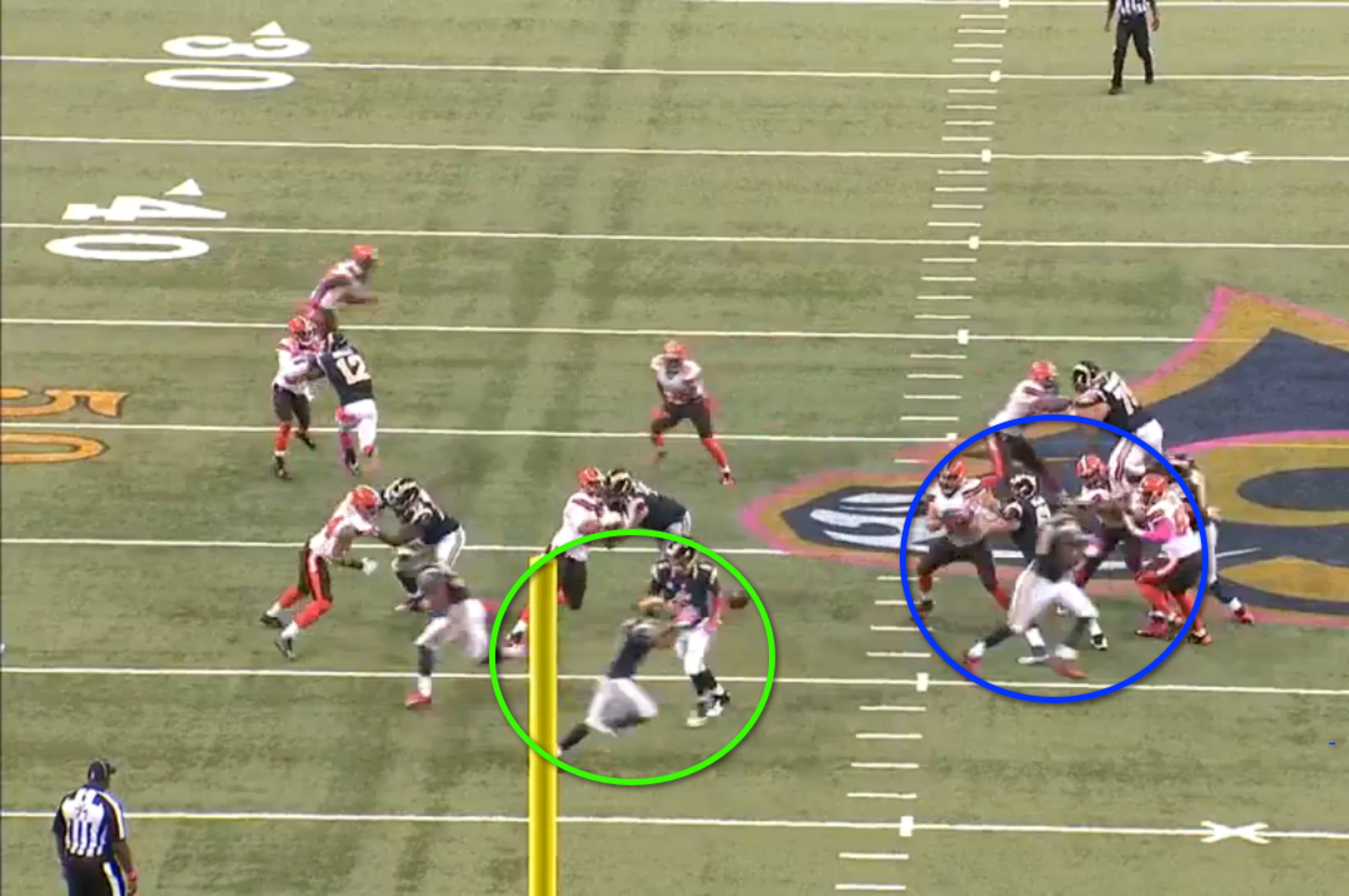 Nick Foles fakes the hand off to Todd Gurley and flips the ball to Tavon Austin as he sweeps through the backfield. Notice Jared Cook; he's positioning himself to lead-block around the right side. Nick Foles fakes the hand off to Todd Gurley and flips the ball to Tavon Austin as he sweeps through the backfield. Notice Jared Cook; he's positioning himself to lead-block around the right side.