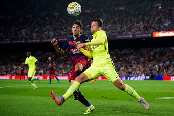 BARCELONA, SPAIN - SEPTEMBER 20:  Munir El Haddadi (L) of FC Barcelona and Antonio 'Tono' Garcia (R) of Levante UD fight for the ball during the La Liga match between FC Barcelona and Levante UD at Camp Nou on September 20, 2015 in Barcelona, Spain.  (Pho