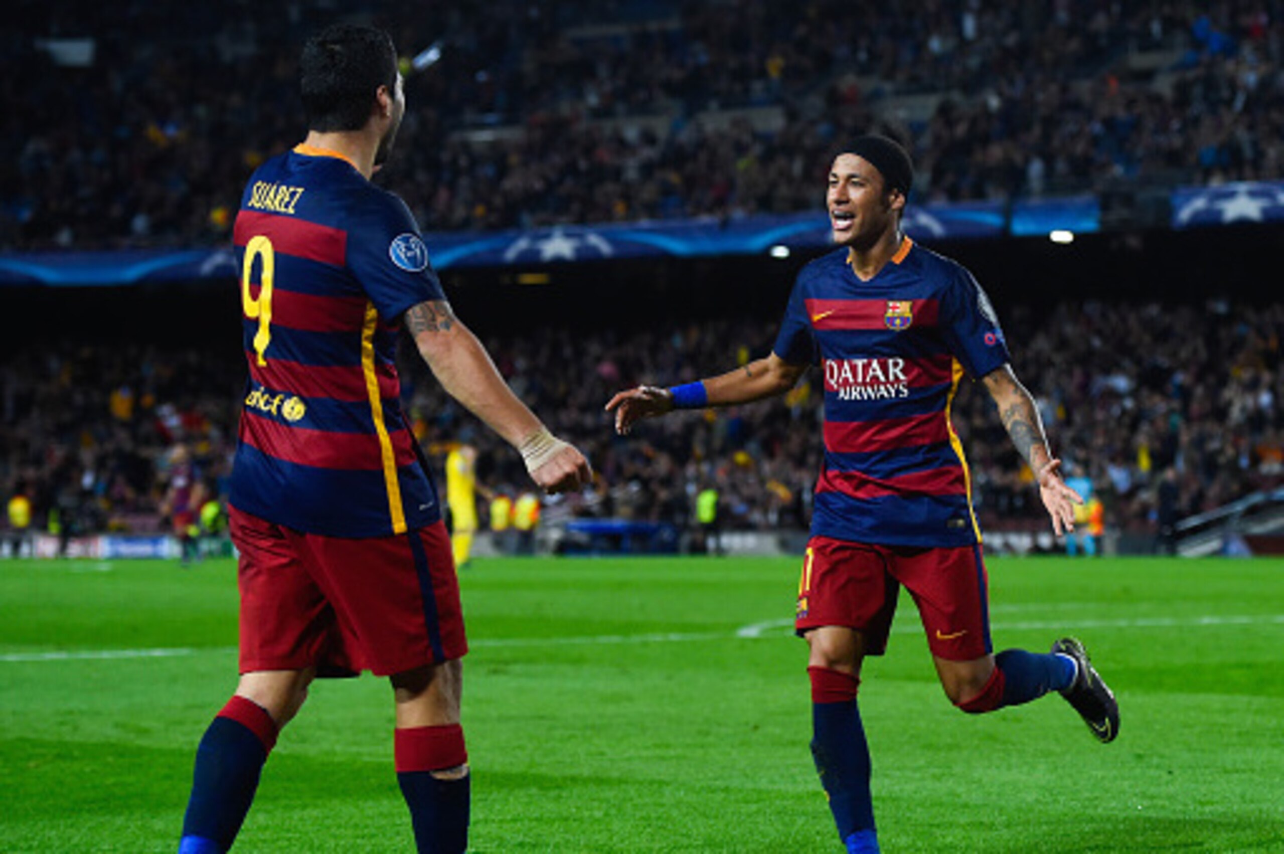 BARCELONA, SPAIN - NOVEMBER 04:  Neymar (R) of FC Barcelona celebrates with his team mate Luis Suarez after scoring his team's third goalduring the UEFA Champions League Group E match between FC Barcelona and FC BATE Borisov at the Camp Nou on November 4,