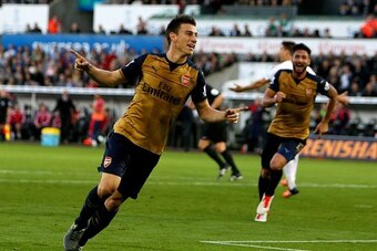 Arsenal's French defender Laurent Koscielny celebrates after scoring their second goal during the English Premier League football match between Swansea City and Arsenal at The Liberty Stadium in Swansea, south Wales on October 31, 2015. AFP PHOTO / GEOFF 