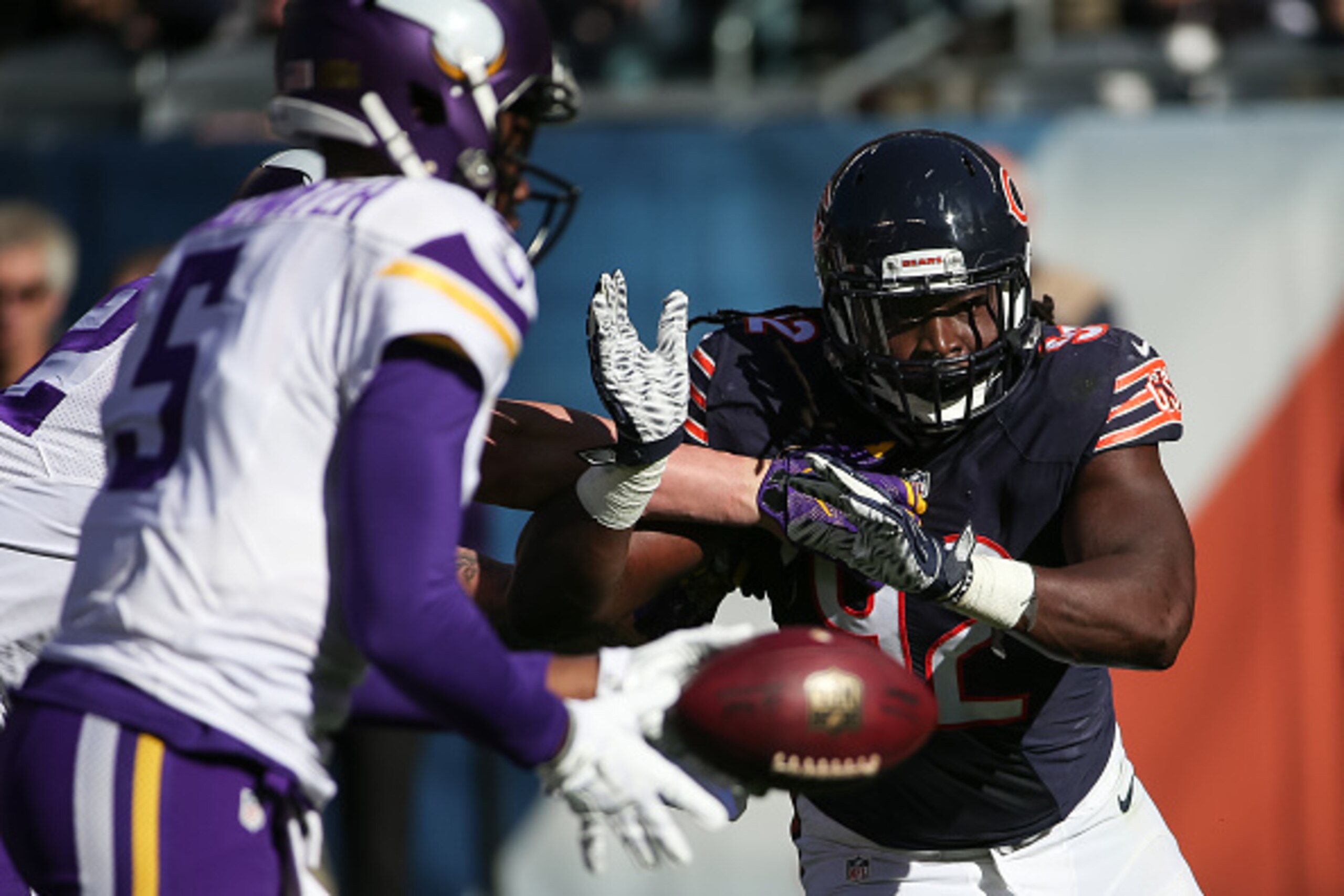 CHICAGO, IL - NOVEMBER 01:   Pernell McPhee #92 of the Chicago Bears is held back from getting to quarterback Teddy Bridgewater #5 of the Minnesota Vikings in the second quarter at Soldier Field on November 1, 2015 in Chicago, Illinois.  (Photo by Jonatha