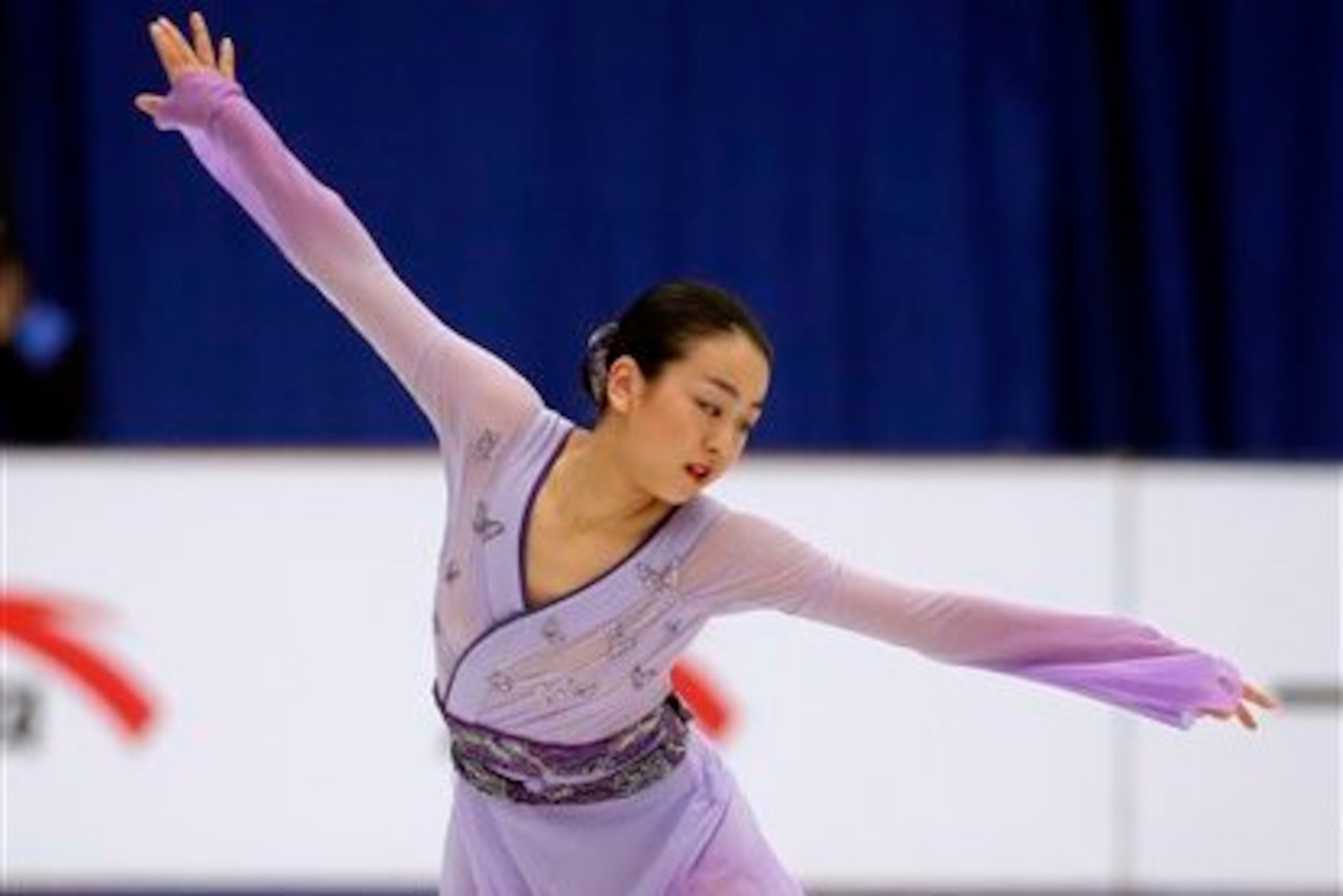 Asada rebounded from an early fall to protect her lead from the short program.