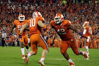CLEMSON, SC - NOVEMBER 7: Ben Boulware #10 of the Clemson Tigers and Christian Wilkins #42 react after making a stop late in the game against the Florida State Seminoles at Memorial Stadium on November 7, 2015 in Clemson, South Carolina. (Photo by Tyler S