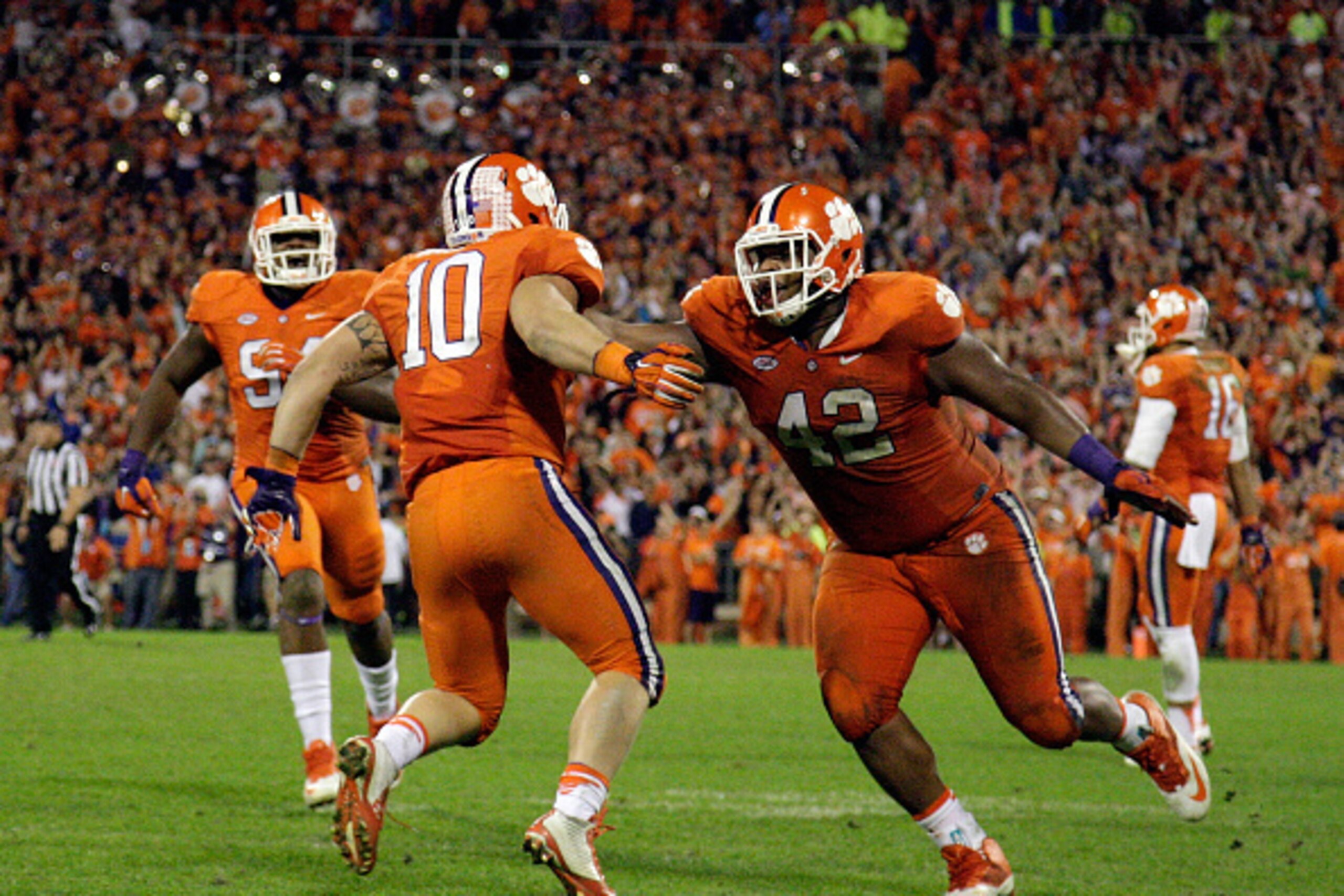 CLEMSON, SC - NOVEMBER 7: Ben Boulware #10 of the Clemson Tigers and Christian Wilkins #42 react after making a stop late in the game against the Florida State Seminoles at Memorial Stadium on November 7, 2015 in Clemson, South Carolina. (Photo by Tyler S CLEMSON, SC - NOVEMBER 7: Ben Boulware #10 of the Clemson Tigers and Christian Wilkins #42 react after making a stop late in the game against the Florida State Seminoles at Memorial Stadium on November 7, 2015 in Clemson, South Carolina. (Photo by Tyler S
