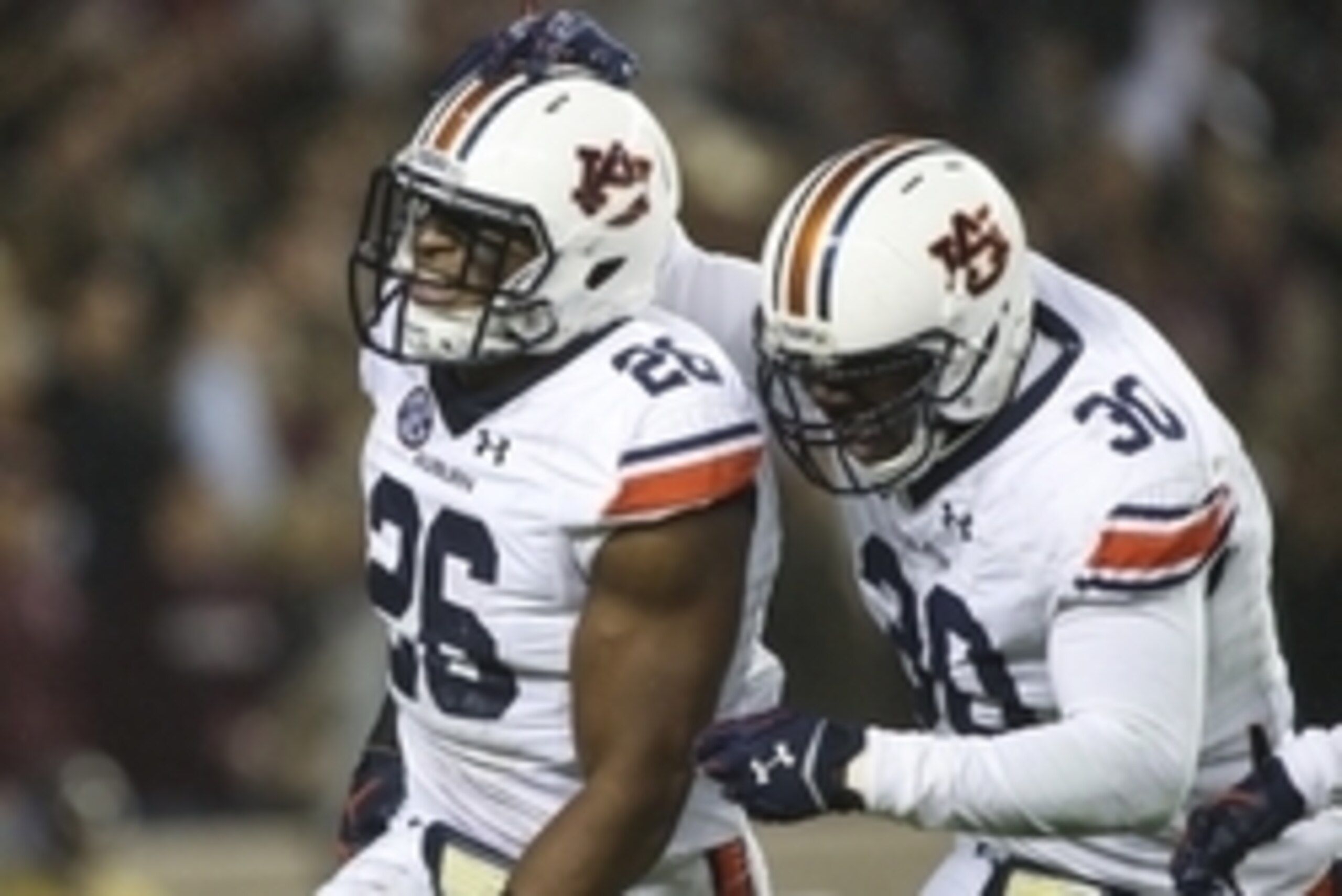 Nov 7, 2015; College Station, TX, USA; Auburn Tigers linebacker Justin Garrett (26) celebrates with linebacker Tre' Williams (30) after an interception against the Texas A&M Aggies during the second quarter at Kyle Field. Mandatory Credit: Troy Taormina-U