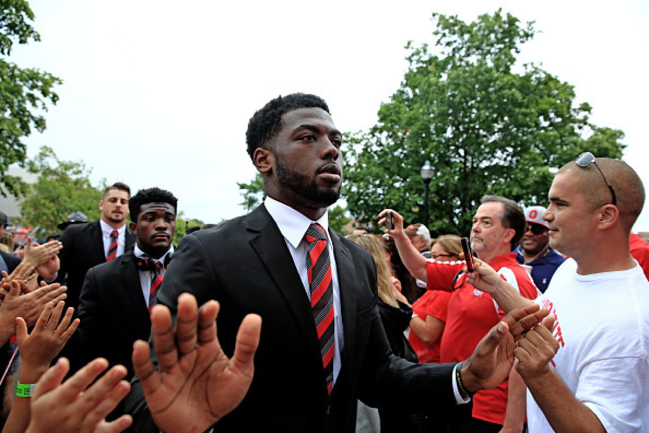 COLUMBUS, OH - SEPTEMBER 19: Quarterback JT Barrett of the Ohio State Buckeyes high fives fans walking to the stadium prior to the game against Northern Illinois Huskies at Ohio Stadium on September 19, 2015 in Columbus, Ohio.  (Photo by Andrew Weber/Gett