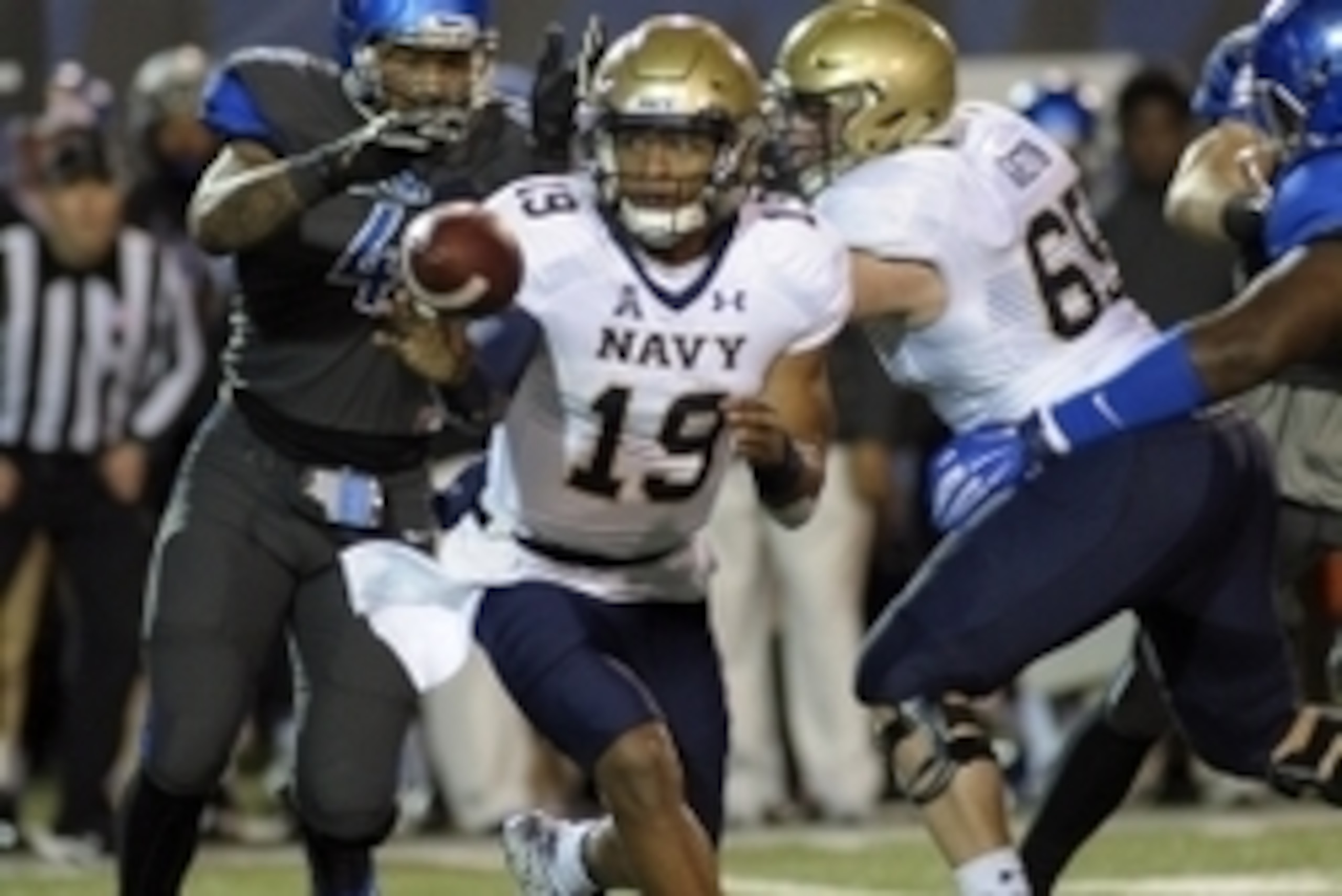 Nov 7, 2015; Memphis, TN, USA; Navy Midshipmen quarterback Keenan Reynolds (19) laterals the ball during the first half against the Memphis Tigers at Liberty Bowl Memorial Stadium. Mandatory Credit: Justin Ford-USA TODAY Sports
