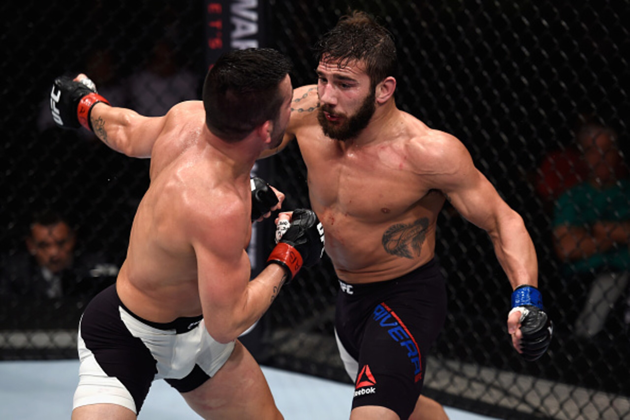 SAO PAULO, BRAZIL - NOVEMBER 07: Pedro Munhoz of Brazil punches Jimmie Rivera of the United States in their bantamweight bout during the UFC Fight Night Belfort v Henderson at Ibirapuera Gymnasium on November 7, 2015 in Sao Paulo, Brazil. (Photo by Buda M