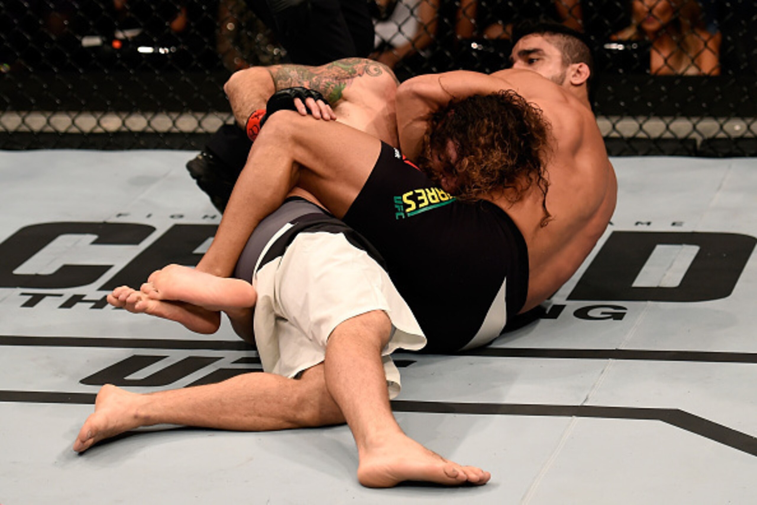 SAO PAULO, BRAZIL - NOVEMBER 07: Thiago Tavares of Brazil submits Clay Guida of the United States in their featherweight bout during the UFC Fight Night Belfort v Henderson at Ibirapuera Gymnasium on November 7, 2015 in Sao Paulo, Brazil. (Photo by Buda M
