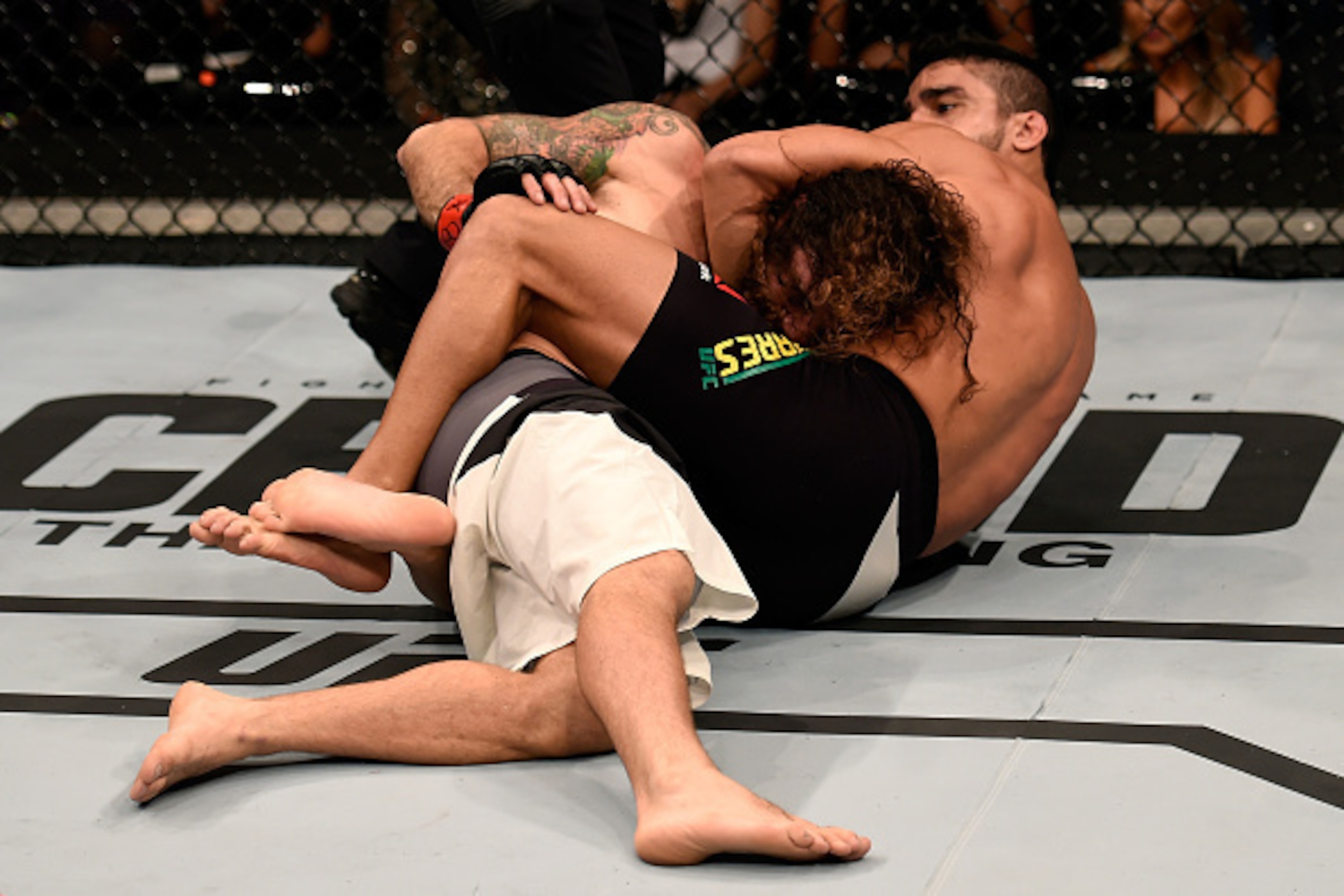 SAO PAULO, BRAZIL - NOVEMBER 07: Thiago Tavares of Brazil submits Clay Guida of the United States in their featherweight bout during the UFC Fight Night Belfort v Henderson at Ibirapuera Gymnasium on November 7, 2015 in Sao Paulo, Brazil. (Photo by Buda M