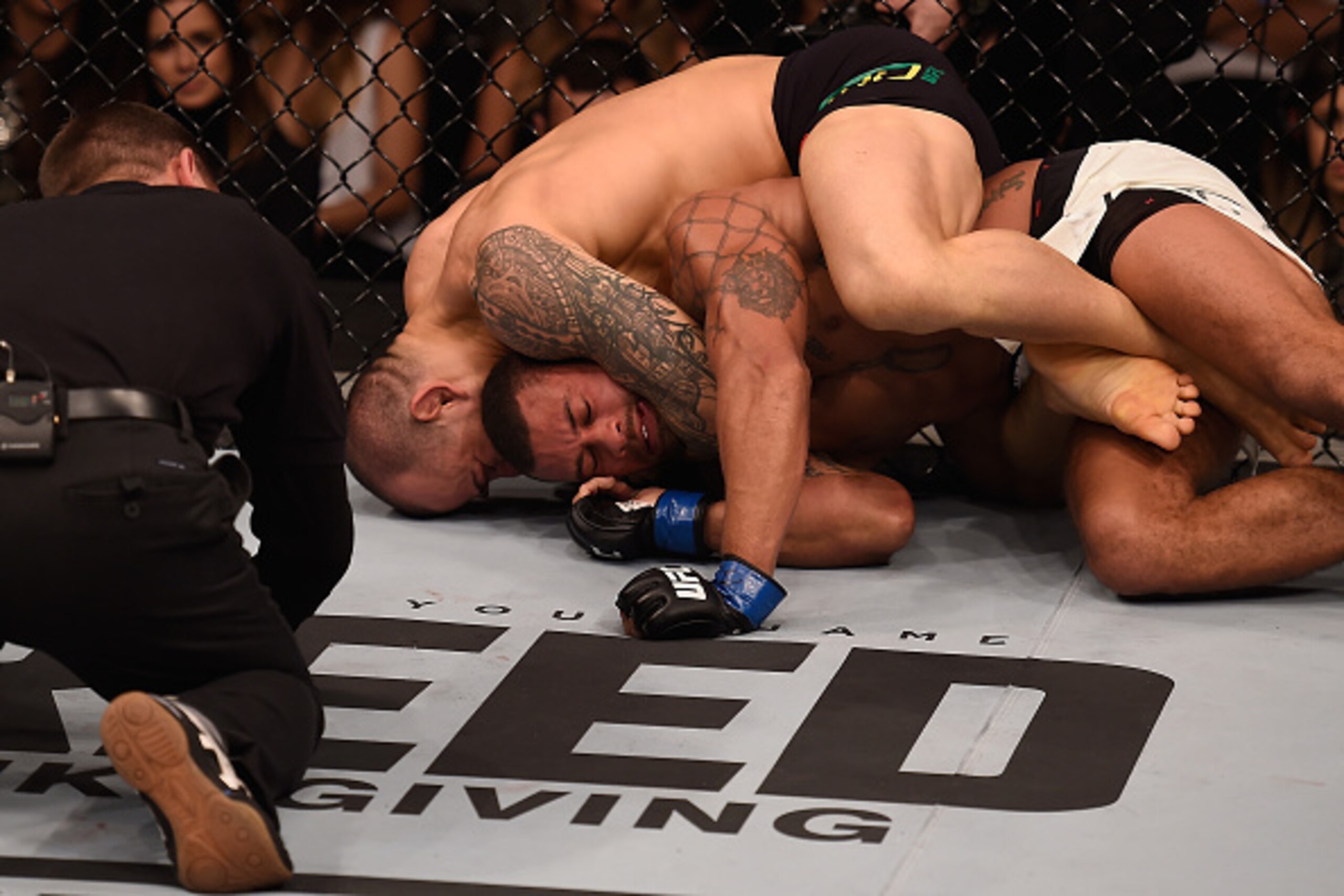 SAO PAULO, BRAZIL - NOVEMBER 07:  Gleison Tibau of Brazil attempts to submit Abel Trujillo of the United States in their lightweight bout  during the UFC Fight Night Belfort v Henderson at Ibirapuera Gymnasium on November 7, 2015 in Sao Paulo, Brazil.  (P