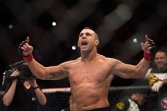 Nov 7, 2015; Sao Paulo, Brazil;  Vitor Belfort (red gloves) reacts after defeating Dan Henderson (blue gloves) during UFC Fight Night at Ibirapuera Gymnasium. Mandatory Credit: Jason Silva-USA TODAY Sports