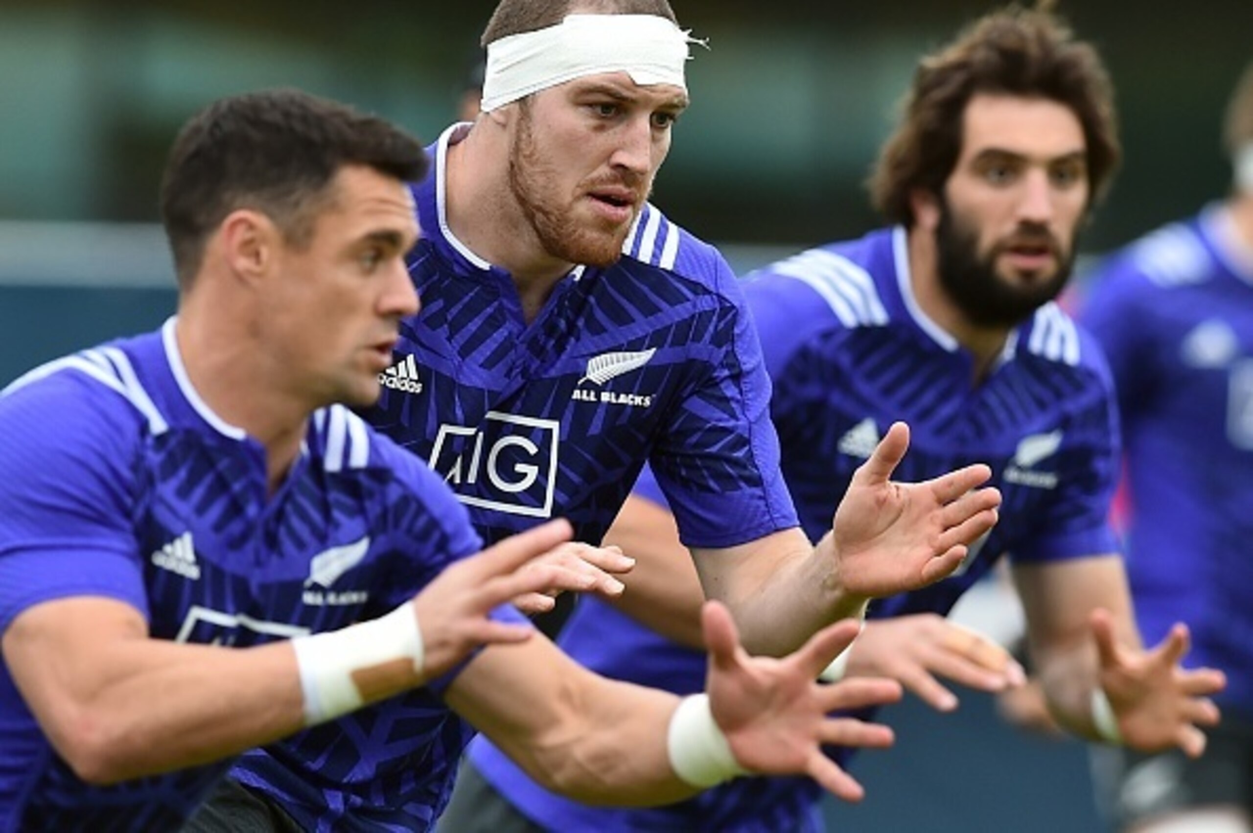 (From L) New Zealand's fly-half Dan Carter,   lock Brodie Retallick and  lock Sam Whitelock  take part  in a team training session in Sunbury-on-Thames, west of London, on October 22, 2015, ahead of their 2015 Rugby Union World Cup semi-final match agains