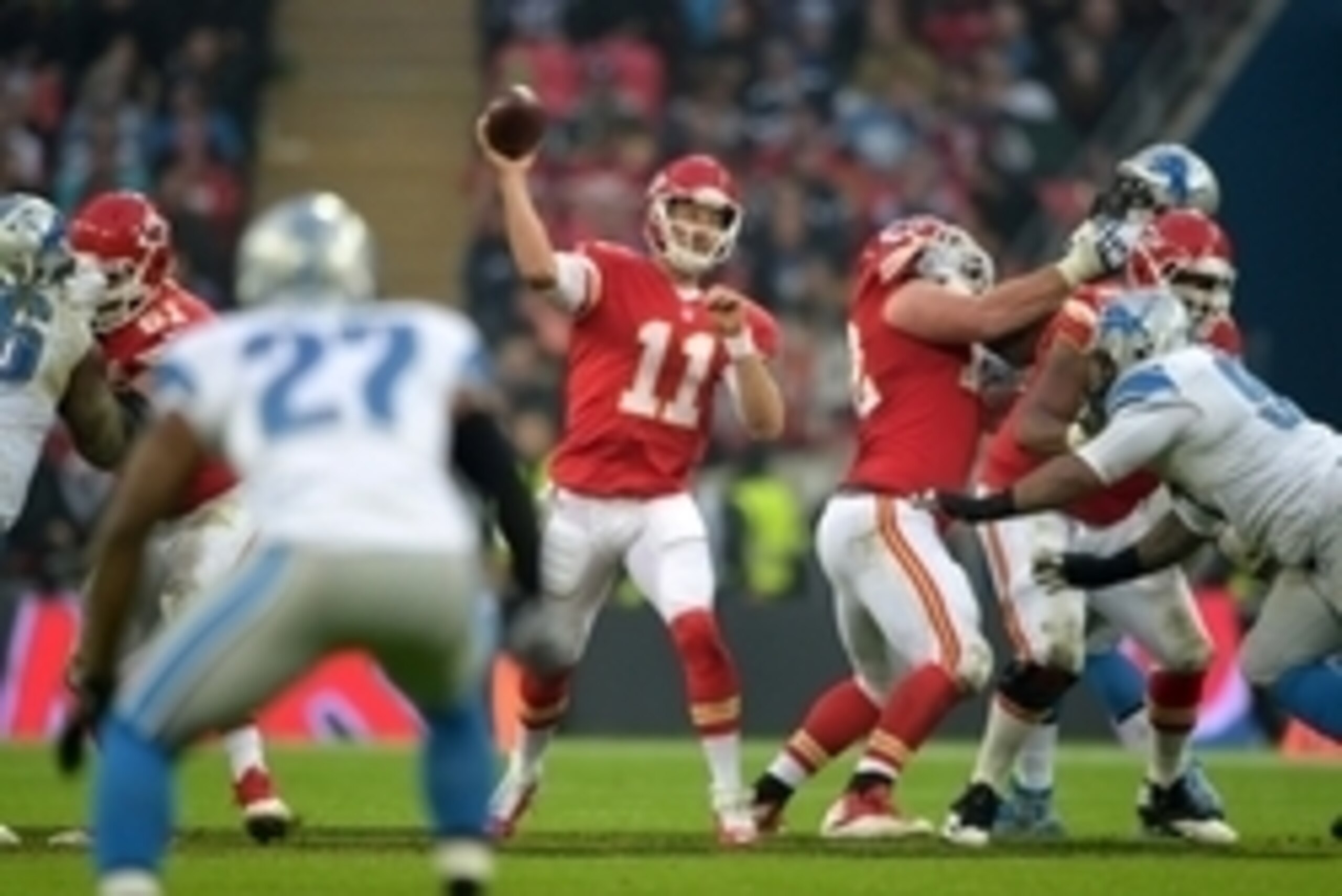 Nov 1, 2015; London, United Kingdom; Kansas City Chiefs quarterback Alex Smith (11) throws a pass against the Detroit Lions during game 14 of the NFL International Series at Wembley Stadium. The Chiefs defeated the Lions 45-10. Mandatory Credit: Kirby Lee