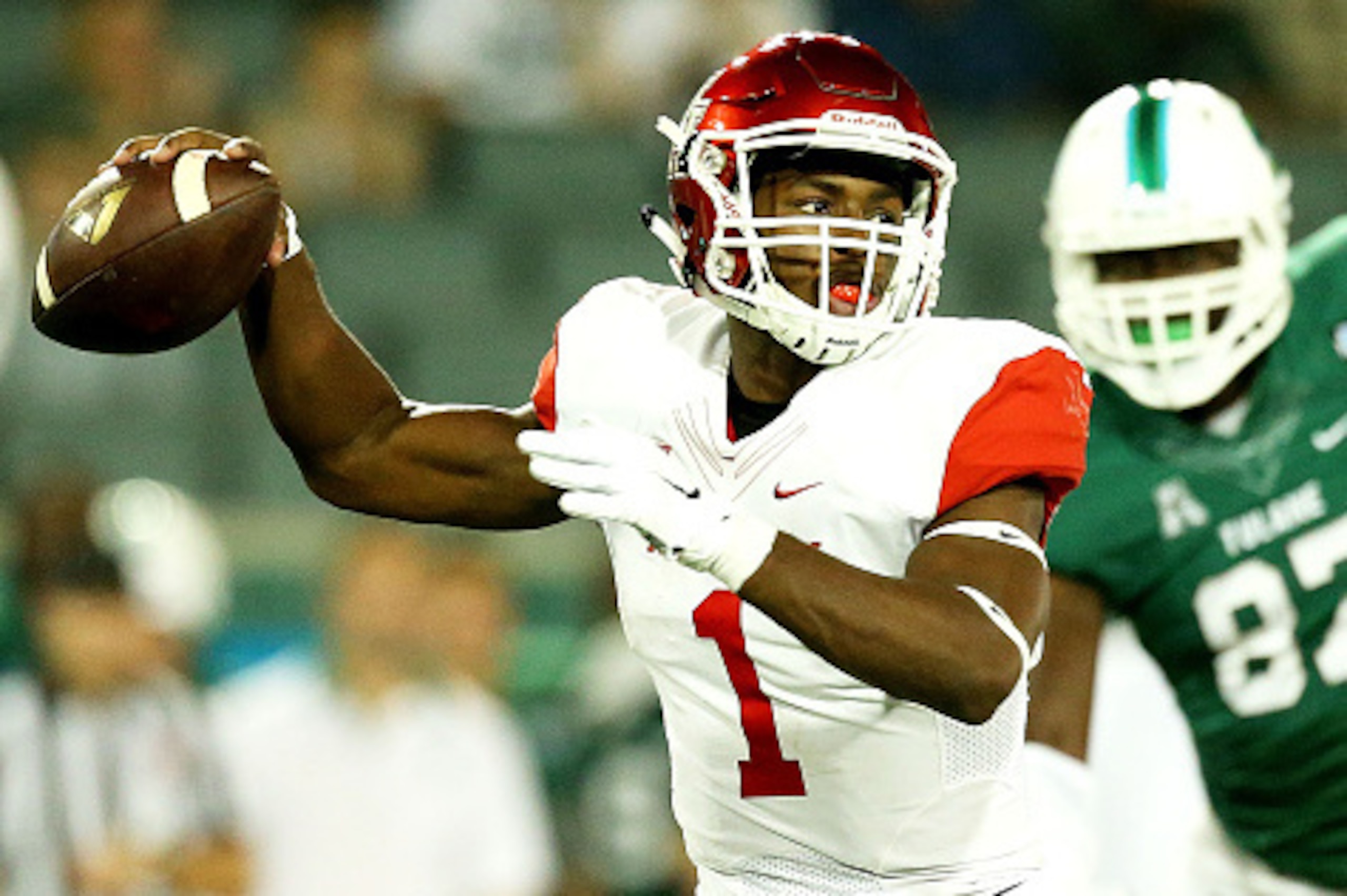 NEW ORLEANS, LA - OCTOBER 16:  Greg Ward Jr. #1 of the Houston Cougars celebrates drops back to pass against the Tulane Green Wave at Yulman Stadium on October 16, 2015 in New Orleans, Louisiana.  (Photo by Sean Gardner/Getty Images)