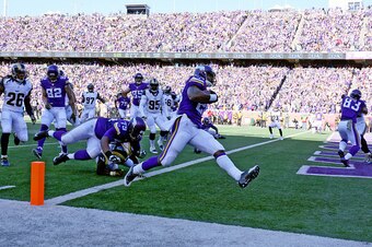 MINNEAPOLIS, MN - NOVEMBER 8:  Adrian Peterson #28 of the Minnesota Vikings carries the ball for a touchdown in the first quarter against the St. Louis Rams on November 8, 2015 at TCF Bank Stadium in Minneapolis, Minnesota. (Photo by Adam Bettcher/Getty I