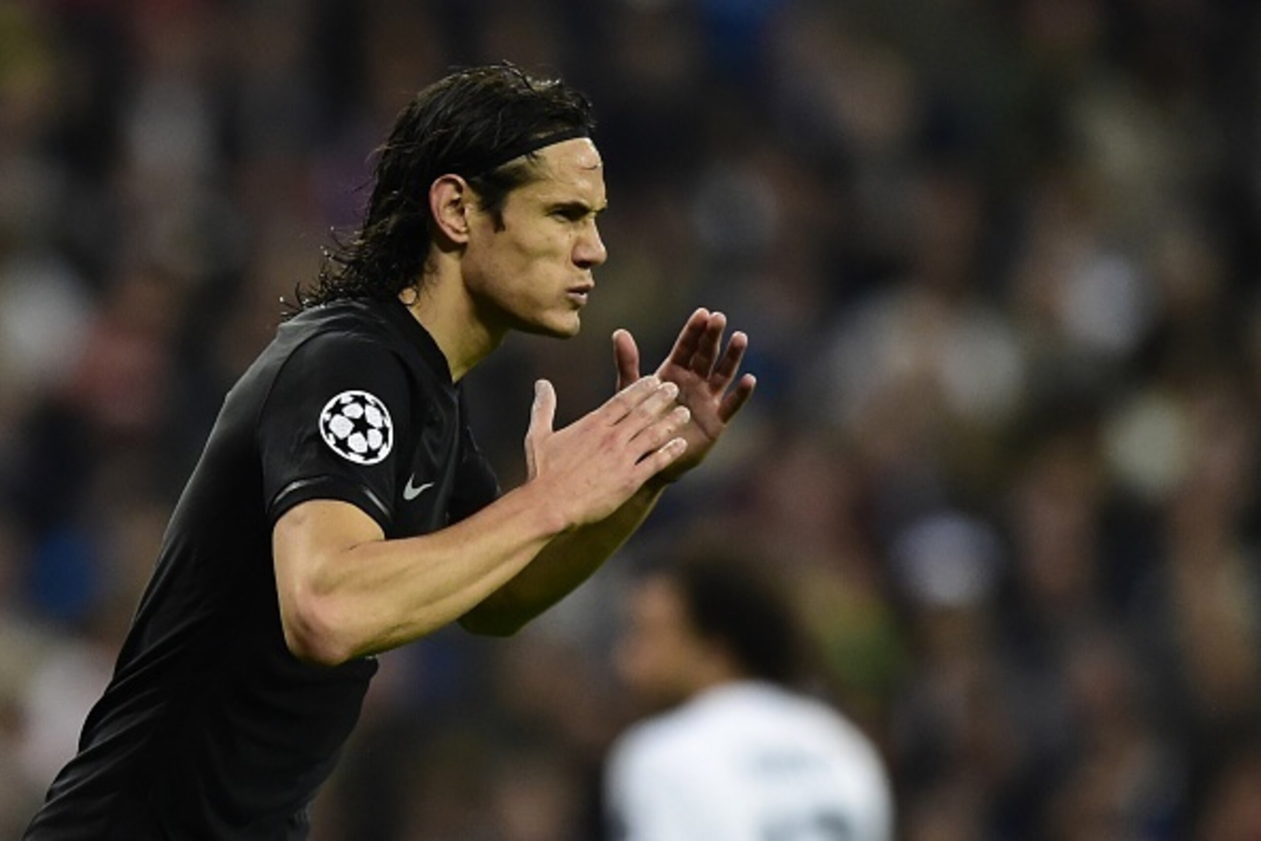 Paris Saint-Germain's Uruguayan forward Edinson Cavani gestures during the UEFA Champions League football match Real Madrid CF vs Paris Saint-Germain (PSG) at the Santiago Bernabeu stadium in Madrid on November 3, 2015.   AFP PHOTO / JAVIER SORIANO       