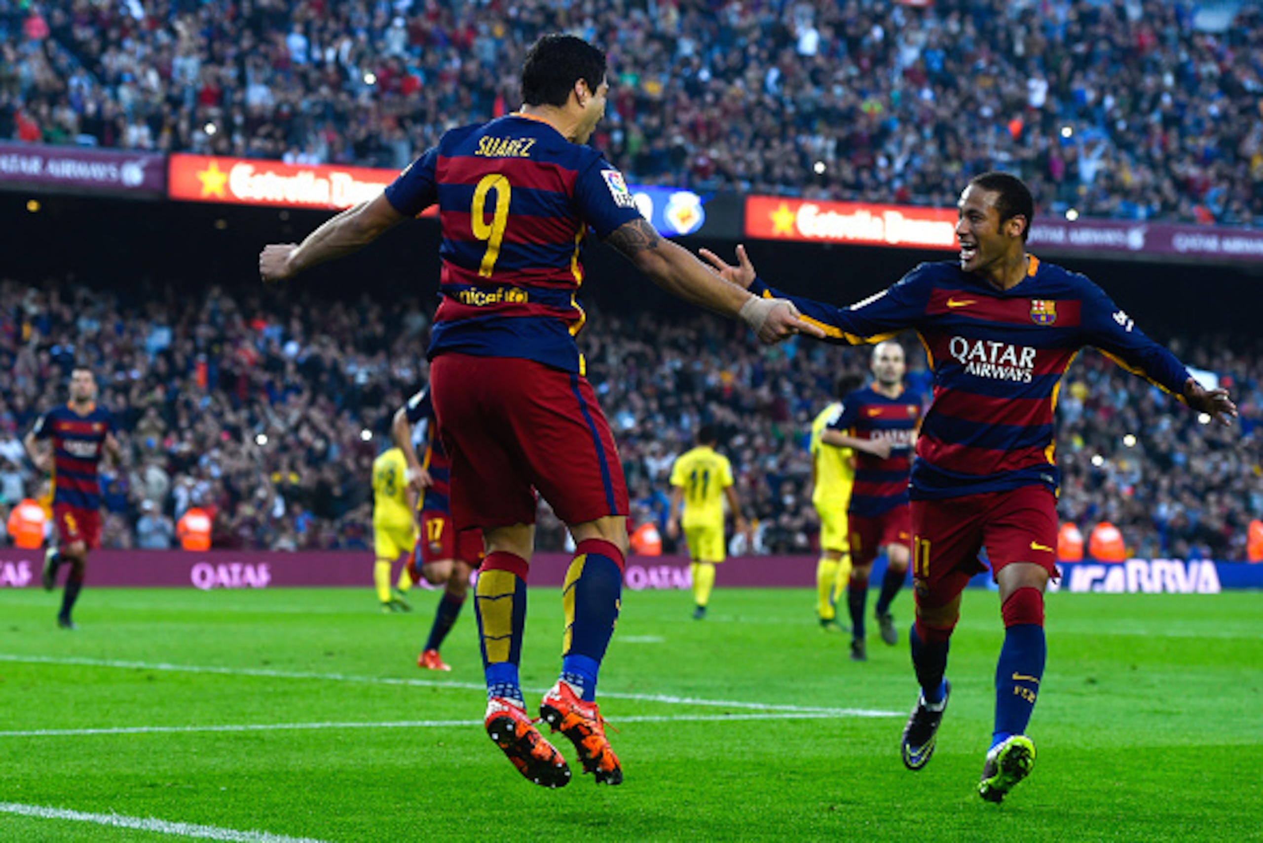 BARCELONA, SPAIN - NOVEMBER 08:  Luis Suarez of FC Barcelona celebrates with his team mate Neymar of FC Barcelona after scoring his team's second goal from the penalty spot during the La Liga match between FC Barcelona and Villarreal CF at Camp Nou on Nov