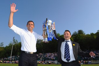 Tony Bloom (right) celebrates 2011 League One title success with Gus Poyet