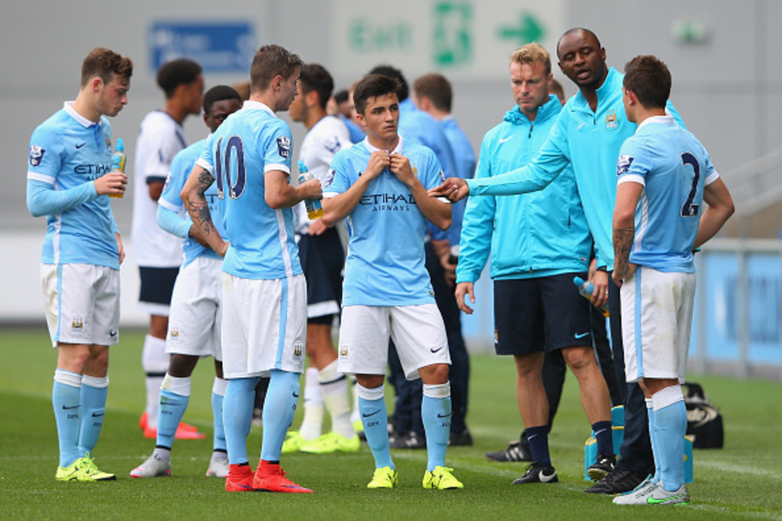 MANCHESTER, ENGLAND - AUGUST 14:  Patrick Vieira the coach of Manchester City U21 talks to his players during the Barclays U21 Premier League match between Manchester City U21 and Tottenham Hotspur U21 at The Academy Stadium on August 14, 2015 in Manchest