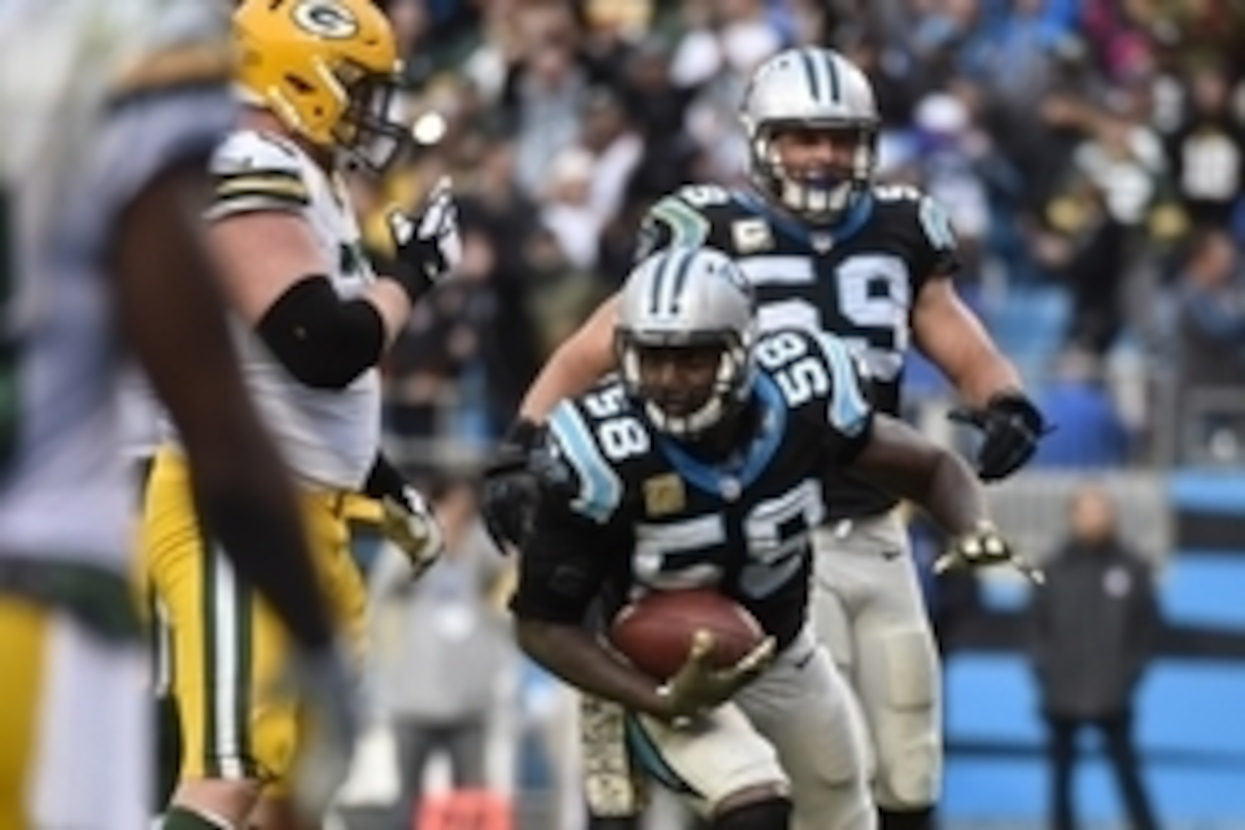 Nov 8, 2015; Charlotte, NC, USA; Carolina Panthers outside linebacker Thomas Davis (58) intercepts the ball late in the fourth quarter. The Panthers defeated the Packers 37-29 at Bank of America Stadium. Mandatory Credit: Bob Donnan-USA TODAY Sports