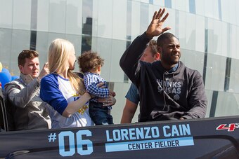 KANSAS CITY, MO - NOVEMBER 03:  Lorenzo Cain of the Kansas City Royals waves to fans along the parade route in fron of Sprint Center on November 3, 2015 in Kansas City, Missouri.  (Photo by Jason Squires/Getty Images)