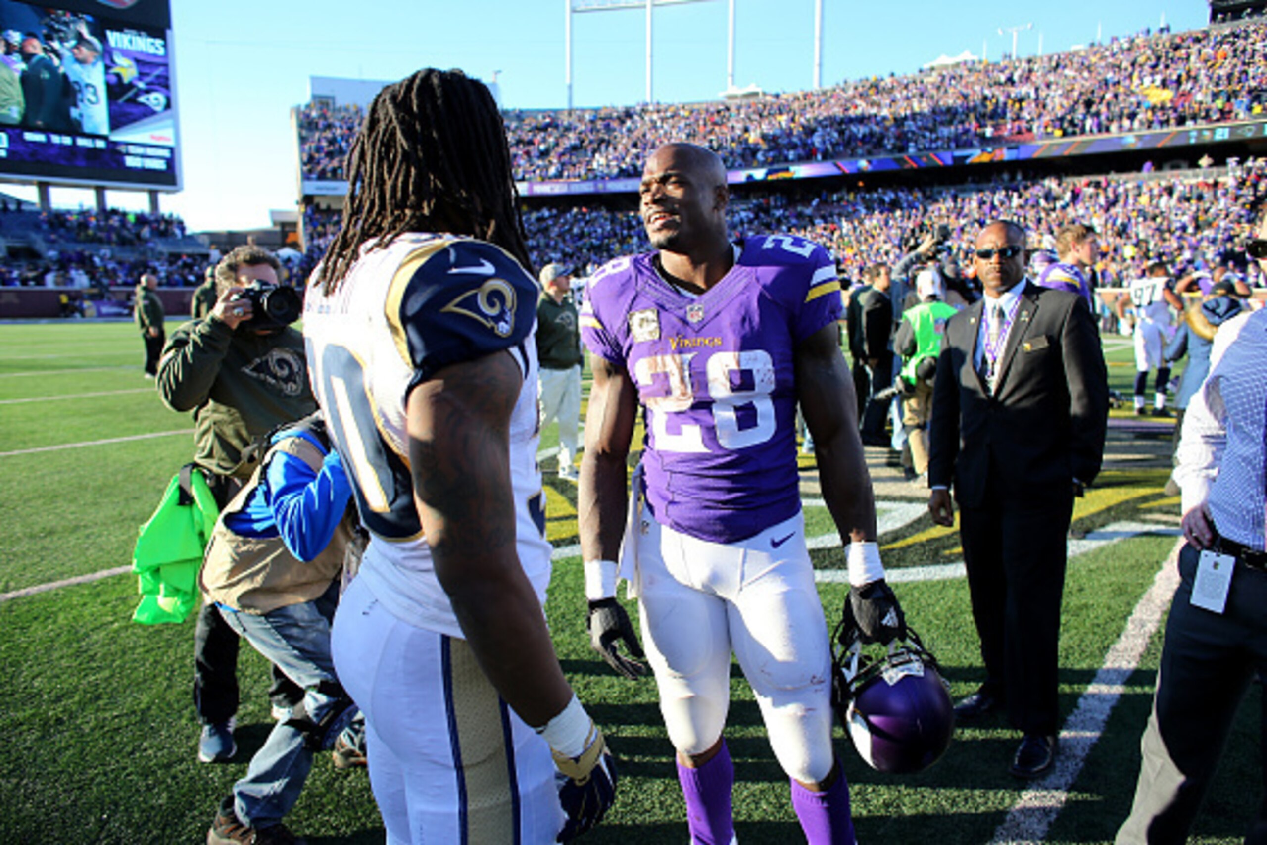 MINNEAPOLIS, MN - NOVEMBER 8:  Adrian Peterson #28 of the Minnesota Vikings greets Todd Gurley #30 of the St. Louis Rams after the Vikings defeated the Rams 21-18 in overtime on November 8, 2015 at TCF Bank Stadium in Minneapolis, Minnesota. (Photo by Ada
