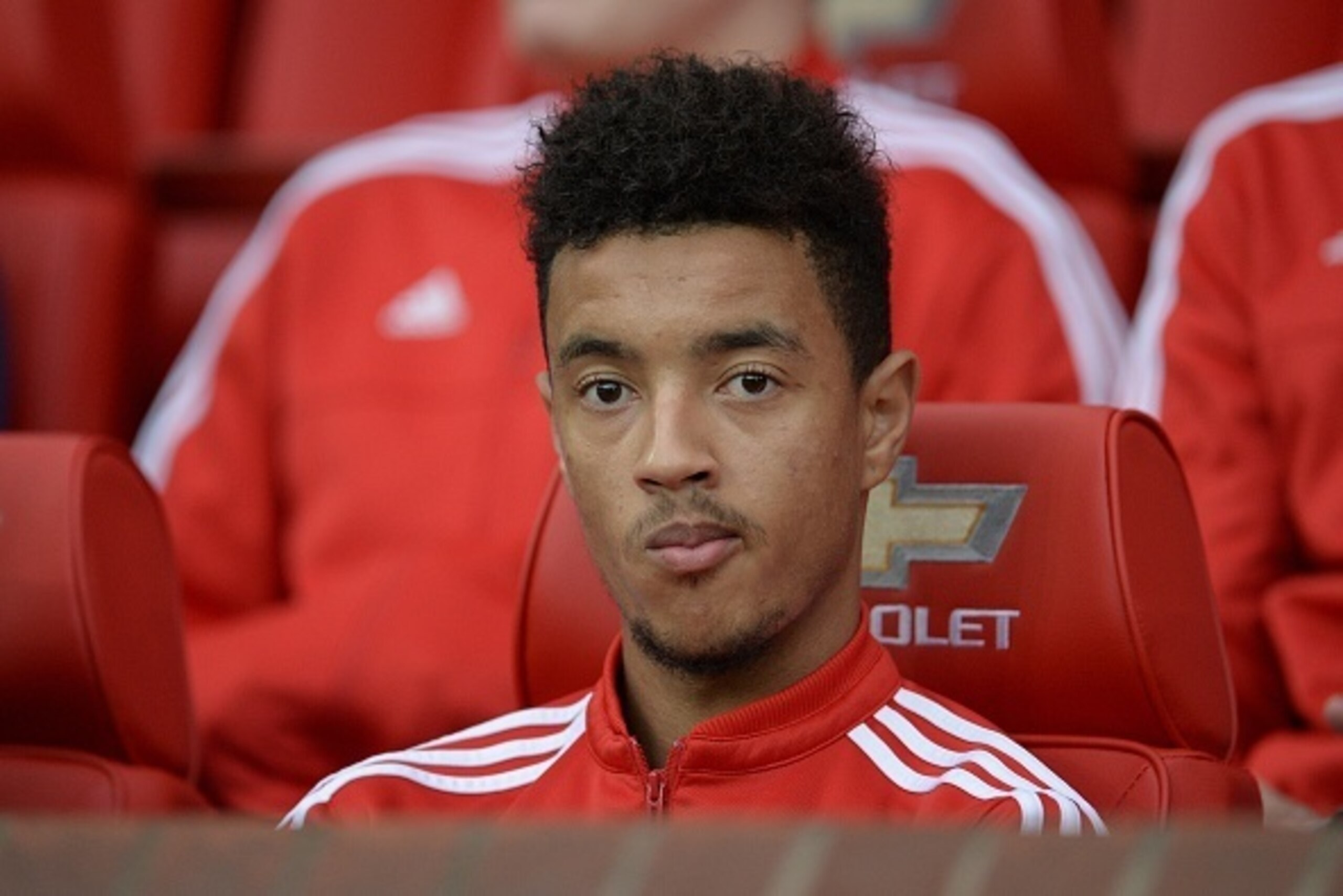 Manchester United's English defender Cameron Borthwick-Jackson sits in the dugout during the English Premier League football match between Manchester United and West Bromwich Albion at Old Trafford stadium in Manchester, north west England, on November 7,