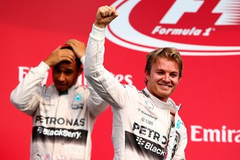 MEXICO CITY, MEXICO - NOVEMBER 01:  Nico Rosberg of Germany and Mercedes GP celebrates on the podium next to Lewis Hamilton of Great Britain and Mercedes GP after winning the Formula One Grand Prix of Mexico at Autodromo Hermanos Rodriguez  on November 1,