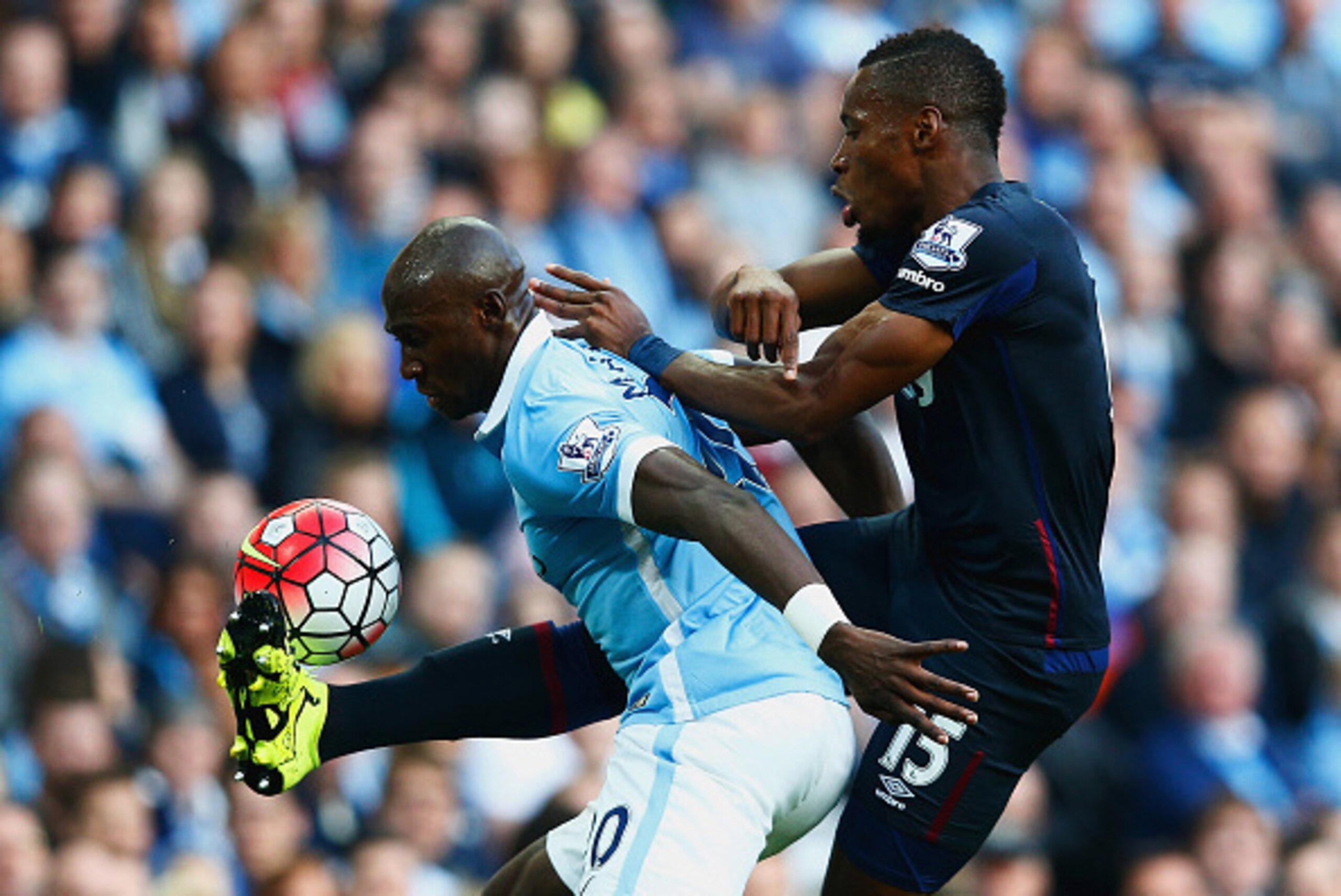 MANCHESTER, ENGLAND - SEPTEMBER 19: Diafra Sakho of West Ham United and Eliaquim Mangala of Manchester City compete for the ball during the Barclays Premier League match between Manchester City and West Ham United at Etihad Stadium on September 19, 2015 MANCHESTER, ENGLAND - SEPTEMBER 19: Diafra Sakho of West Ham United and Eliaquim Mangala of Manchester City compete for the ball during the Barclays Premier League match between Manchester City and West Ham United at Etihad Stadium on September 19, 2015