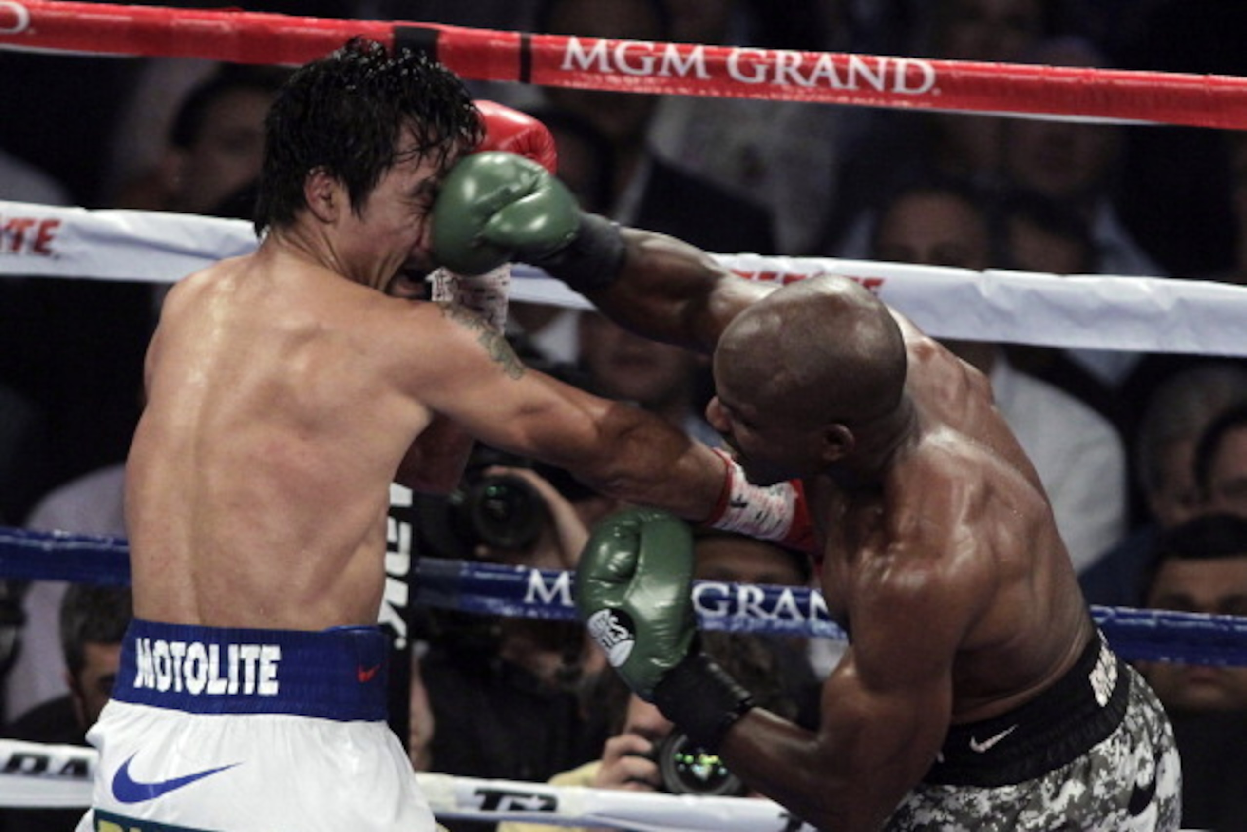 Manny Pacquiao (L) of the Philippines exchanges blows with Timothy Bradley (R) of the US during their WBO welterweight title fight on April 12, 2014 at the MGM Grand Garden Arena in Las Vegas, Nevada. Pacquiao won a 12-round unanimous decision over B Manny Pacquiao (L) of the Philippines exchanges blows with Timothy Bradley (R) of the US during their WBO welterweight title fight on April 12, 2014 at the MGM Grand Garden Arena in Las Vegas, Nevada. Pacquiao won a 12-round unanimous decision over B