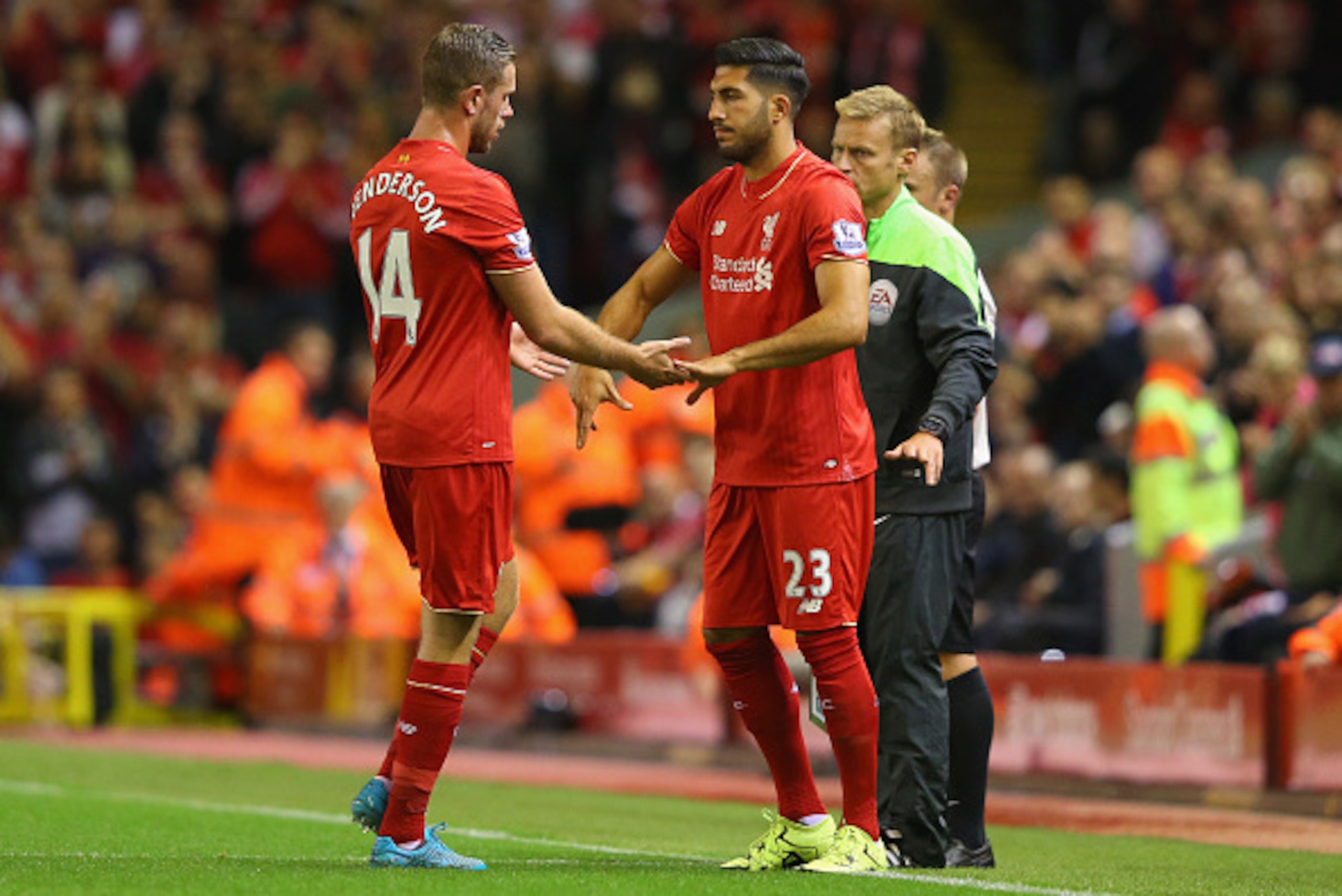 LIVERPOOL, ENGLAND - AUGUST 17:  Jordan Henderson of Liverpool shakes hands with team mate Emre Can as he is substituted during the Barclays Premier League match between Liverpool and A.F.C. Bournemouth at Anfield on August 17, 2015 in Liverpool, United K