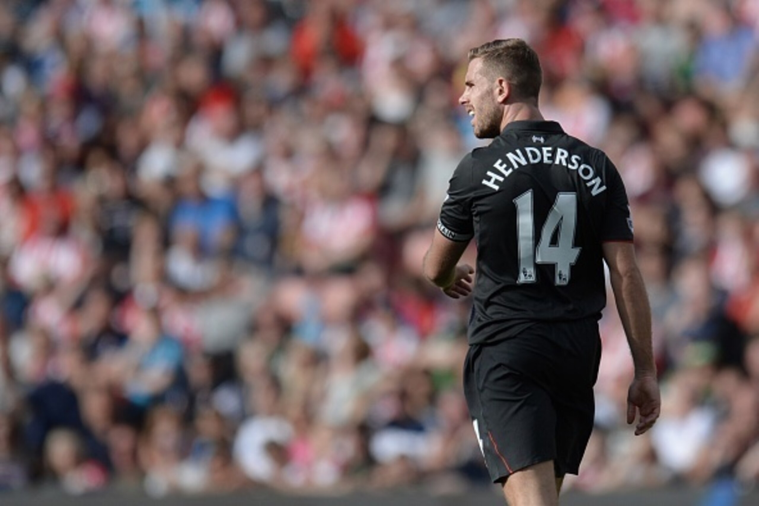Liverpool's English midfielder Jordan Henderson looks on during the English Premier League football match between Stoke City and Liverpool at the Britannia Stadium in Stoke-on-Trent, central England on August 9, 2015. Liverpool won the game 1-0. AFP PHOTO