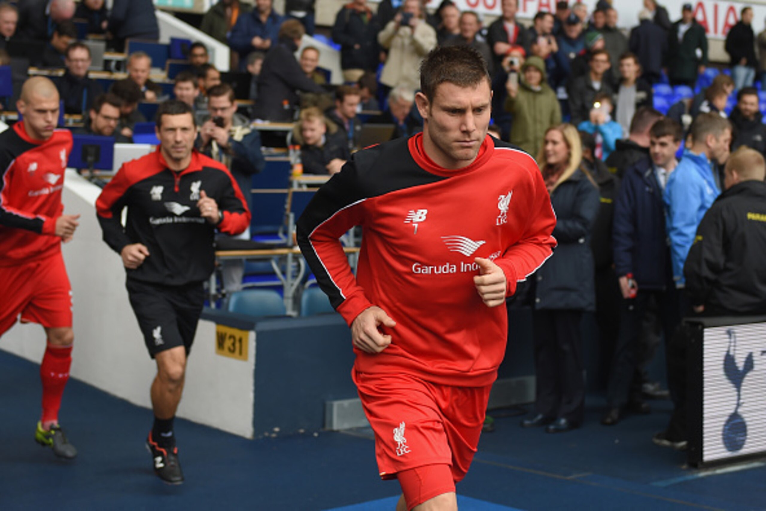 LONDON, ENGLAND - OCTOBER 17: James Milner of Liverpool runs into the pitch for the warm-up prior to the Barclays Premier League match between Tottenham Hotspur and Liverpool at White Hart Lane on October 17, 2015 in London, England.  (Photo by Michael Re