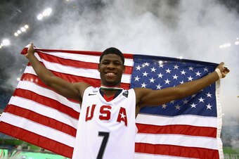 DUBAI, UNITED ARAB EMIRATES - AUGUST 16: Malik Newman of the United States celebrates after winning the FIBA U17 World Championships Final Match between Australia and the United States of America at the Hamdan Sports Complex on August 16, 2014 in Dubai, U