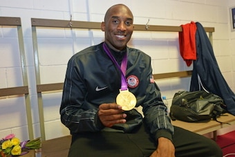 LONDON, ENGLAND - AUGUST 12: Kobe Bryant #10 of the US Men's Senior National Team poses with his Gold Medal after their Men's Gold Medal Basketball Game against Spain on Day 16 of the London 2012 Olympic Games at the North Greenwich Arena on August 12, 20