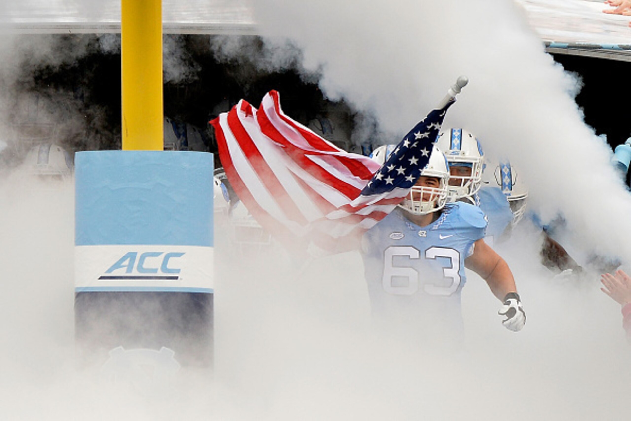CHAPEL HILL, NC - NOVEMBER 07:  Harris Hite #63 of the North Carolina Tar Heels leads the team onto the field for their game against the Duke Blue Devils at Kenan Stadium on November 7, 2015 in Chapel Hill, North Carolina. North Carolina won 66-31.  (Phot