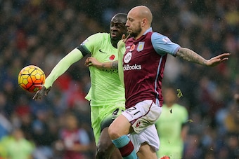 BIRMINGHAM, ENGLAND - NOVEMBER 08:  Yaya Toure of Manchester City and Alan Hutton of Aston Villa during the Barclays Premier League match between Aston Villa and Manchester City at Villa Park on November 8, 2015 in Birmingham, England.  (Phoyo by James Ba