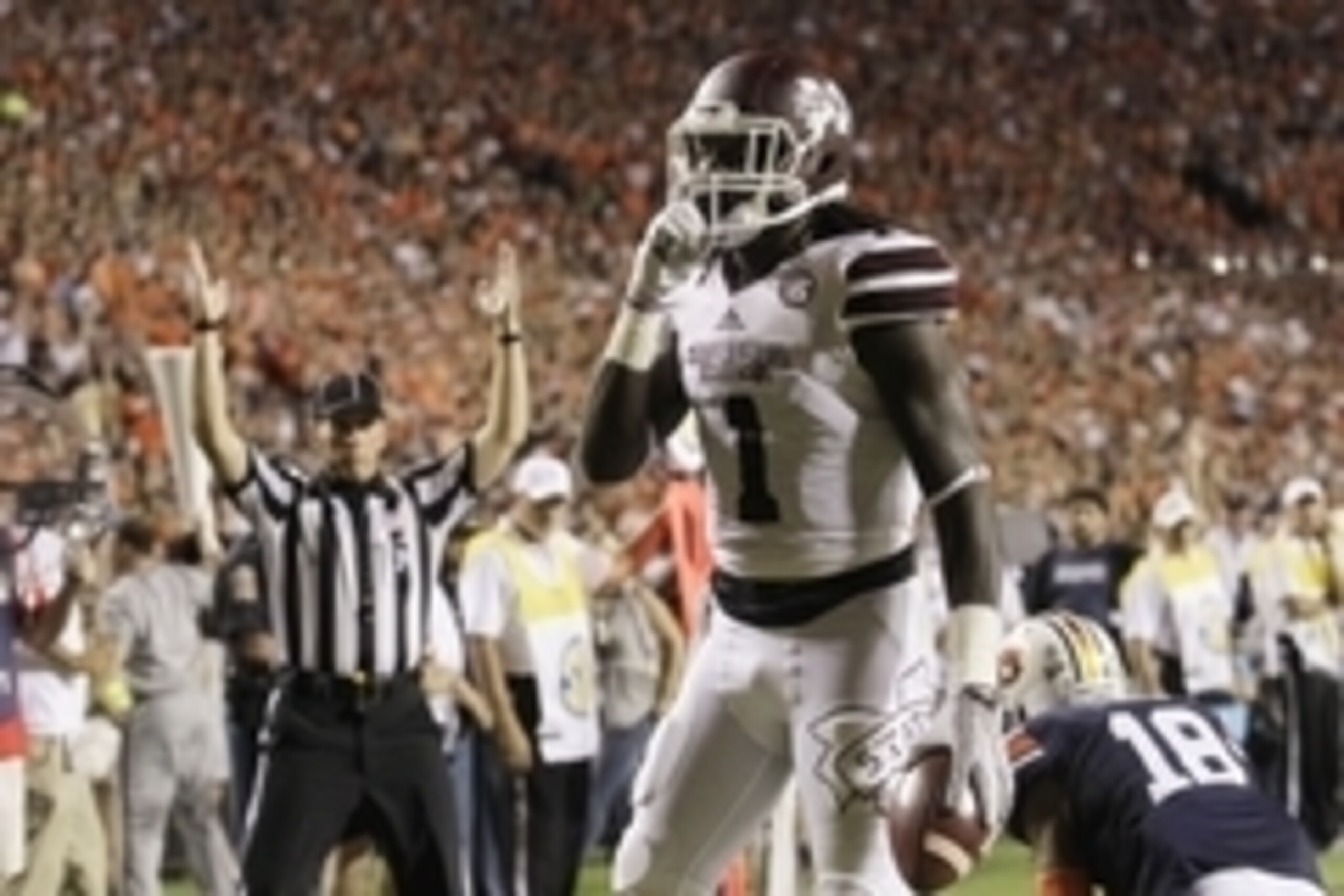 Sep 26, 2015; Auburn, AL, USA; Mississippi State Bulldogs receiver De'Runnya Wilson (1) celebrates after scoring a touchdown against the Auburn Tigers during the second quarter at Jordan Hare Stadium. Mandatory Credit: John Reed-USA TODAY Sports