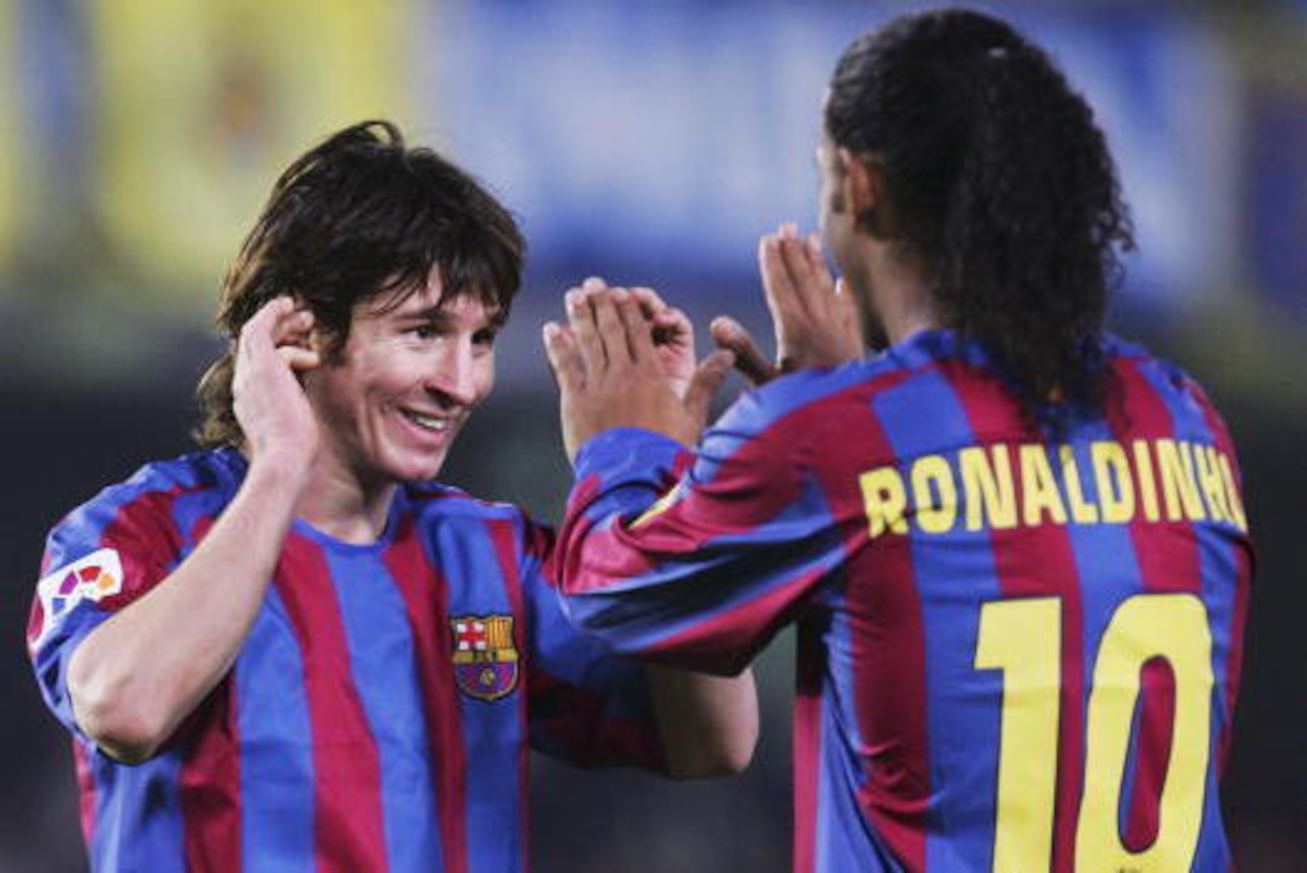 VILLARREAL, SPAIN - DECEMBER 4: Lionel Messi (L) and Ronaldinho of Barcelona celebrate after beating Villarreal 2-0 during the Primera Liga match between Villarreal and F.C. Barcelona on December 4 2005 at the Madrigal stadium in Villarreal, Spain. (Phot VILLARREAL, SPAIN - DECEMBER 4: Lionel Messi (L) and Ronaldinho of Barcelona celebrate after beating Villarreal 2-0 during the Primera Liga match between Villarreal and F.C. Barcelona on December 4 2005 at the Madrigal stadium in Villarreal, Spain. (Phot