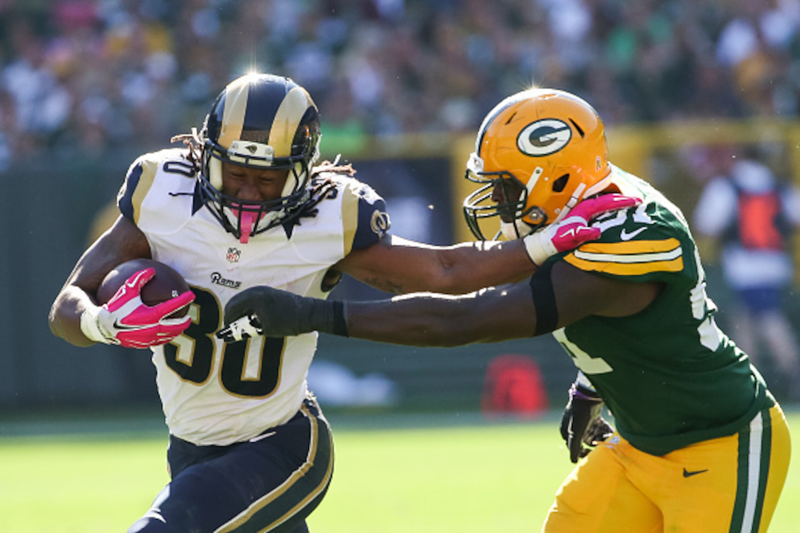 GREEN BAY, WI - OCTOBER 11:  Todd Gurley #30 of the St. Louis Rams carries the football against  Nate Palmer #51 of the Green Bay Packers in the third quarter at Lambeau Field on October 11, 2015 in Green Bay, Wisconsin.  (Photo by Jonathan Daniel/Getty I