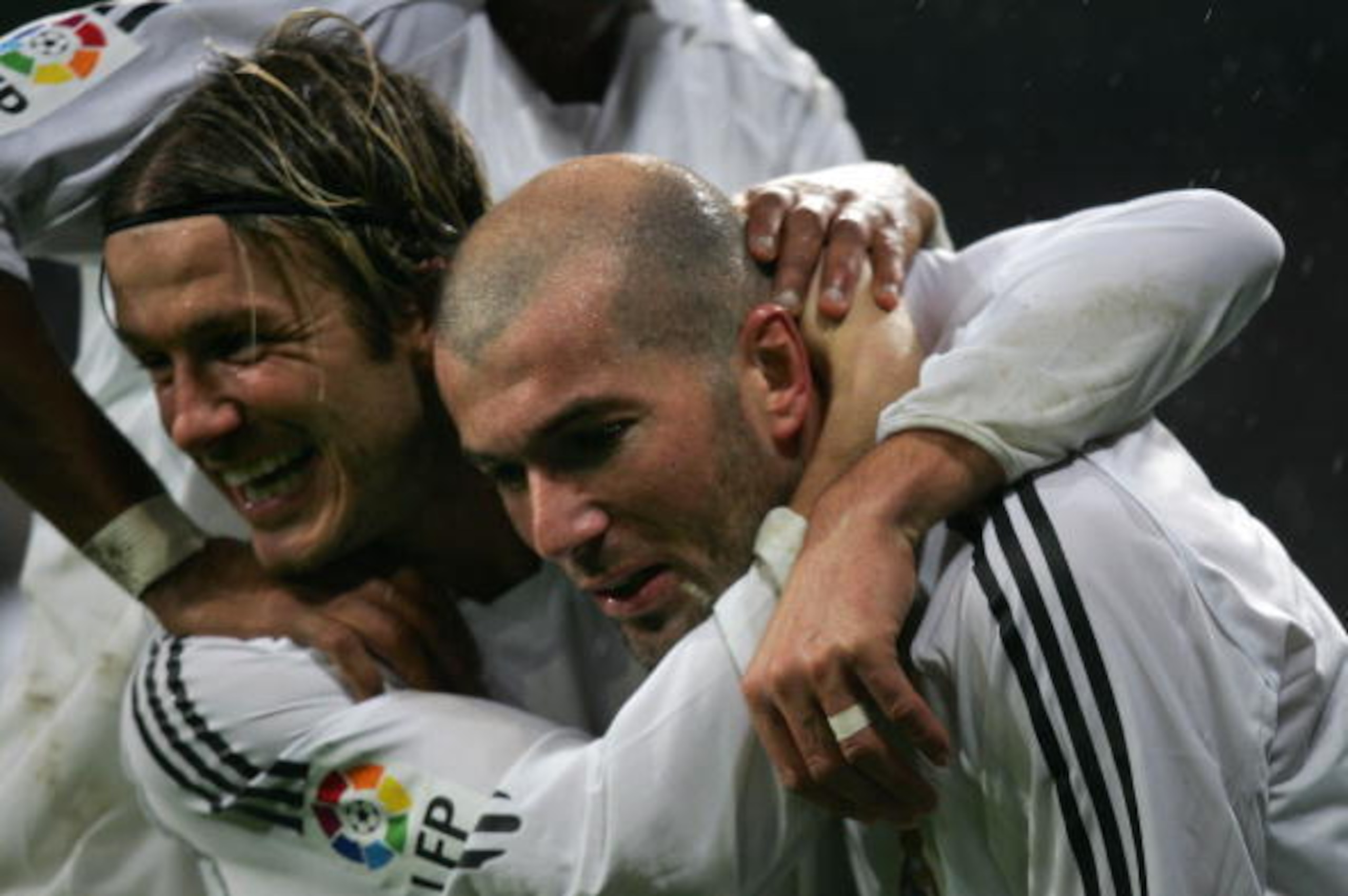 Madrid, SPAIN:  Real Madrid's Zinedine Zidane  and Briton David Beckham celebrate a goal  during their Spanish League football match between Real Madrid and Sevilla, at the Santiago Bernabeu stadium in Madrid, 15 January 2006. AFP PHOTO/PHILIPPE DESMAZES 