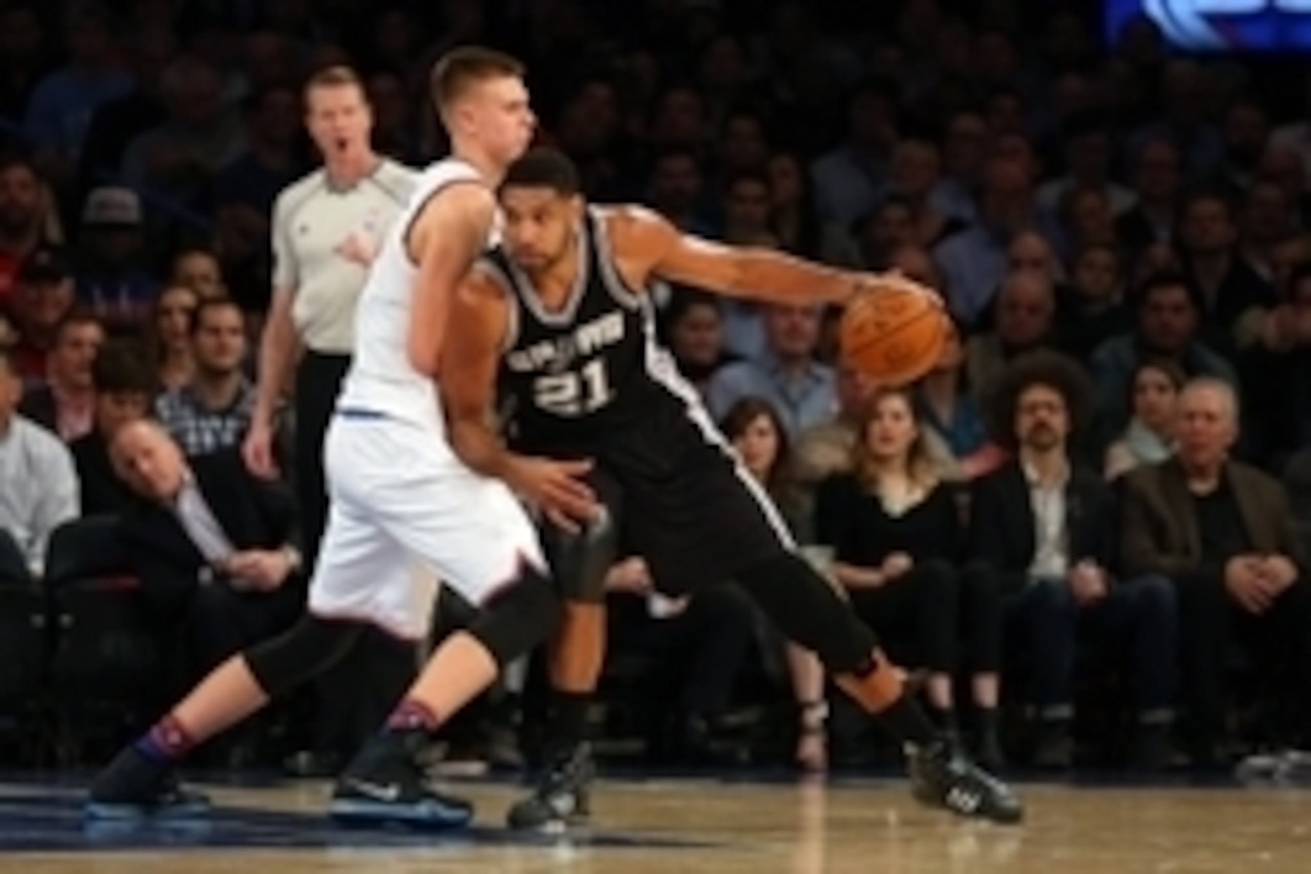 Nov 2, 2015; New York, NY, USA;  San Antonio Spurs forward Tim Duncan (21) drives against New York Knicks forward Kristaps Porzingis (6) during the first quarter at Madison Square Garden. Mandatory Credit: Anthony Gruppuso-USA TODAY Sports
