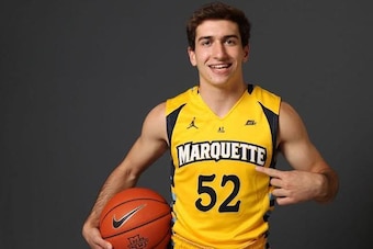 Cam wearing No. 52 for Marquette, just as his dad did