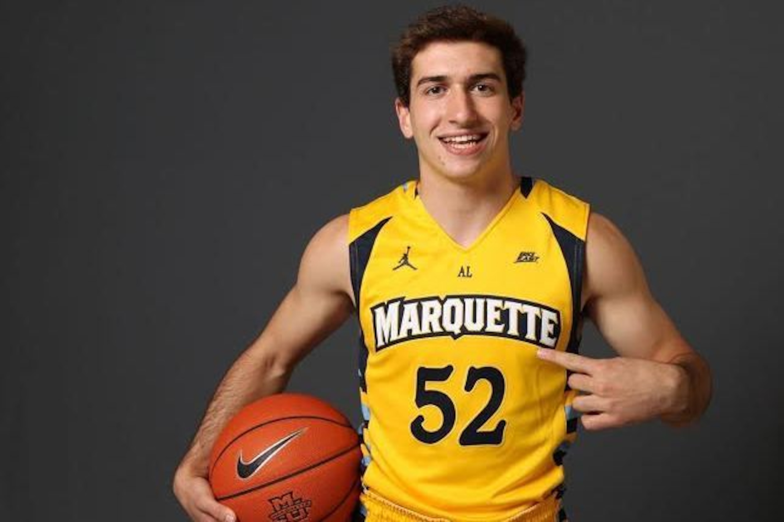Cam wearing No. 52 for Marquette, just as his dad did Cam wearing No. 52 for Marquette, just as his dad did