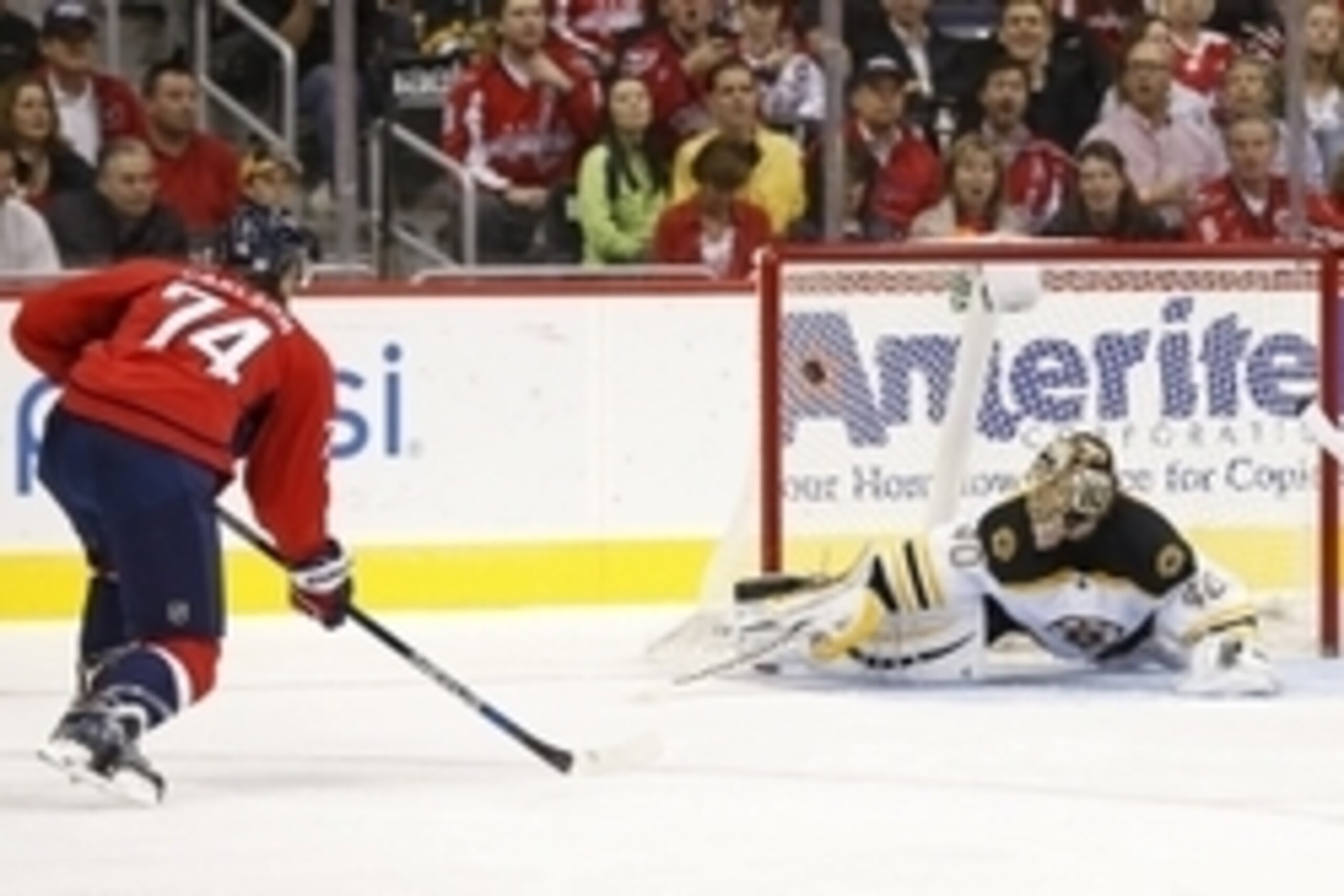 Nov 5, 2015; Washington, DC, USA; Washington Capitals defenseman John Carlson (74) scores a goal on Boston Bruins goalie Tuukka Rask (40) in the second period at Verizon Center. Mandatory Credit: Geoff Burke-USA TODAY Sports