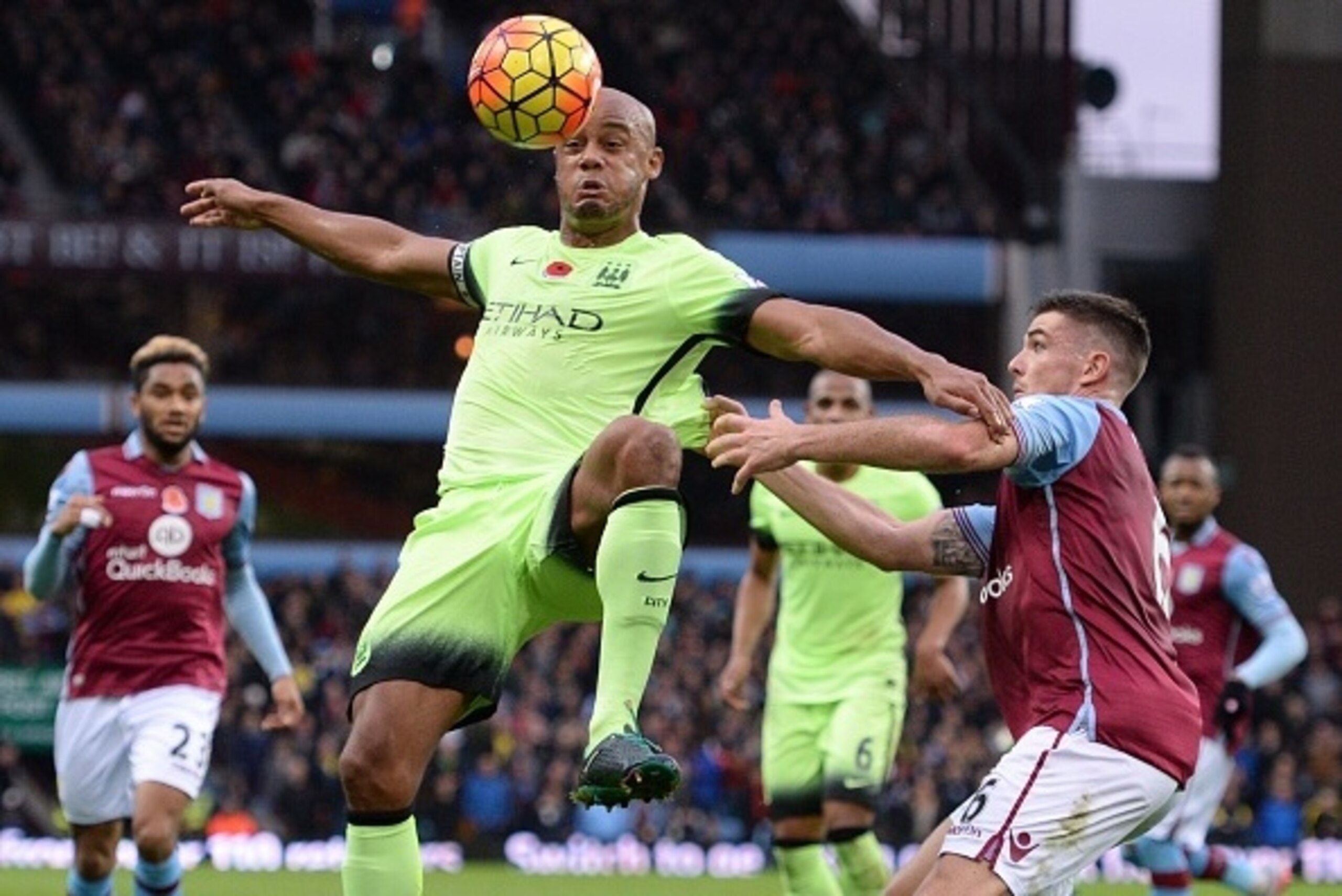 Manchester City's Belgian defender Vincent Kompany (L) vies with Aston Villa's English-born Irish defender Ciaran Clark during the English Premier League football match between Aston Villa and Manchester City at Villa Park in Birmingham, central England o