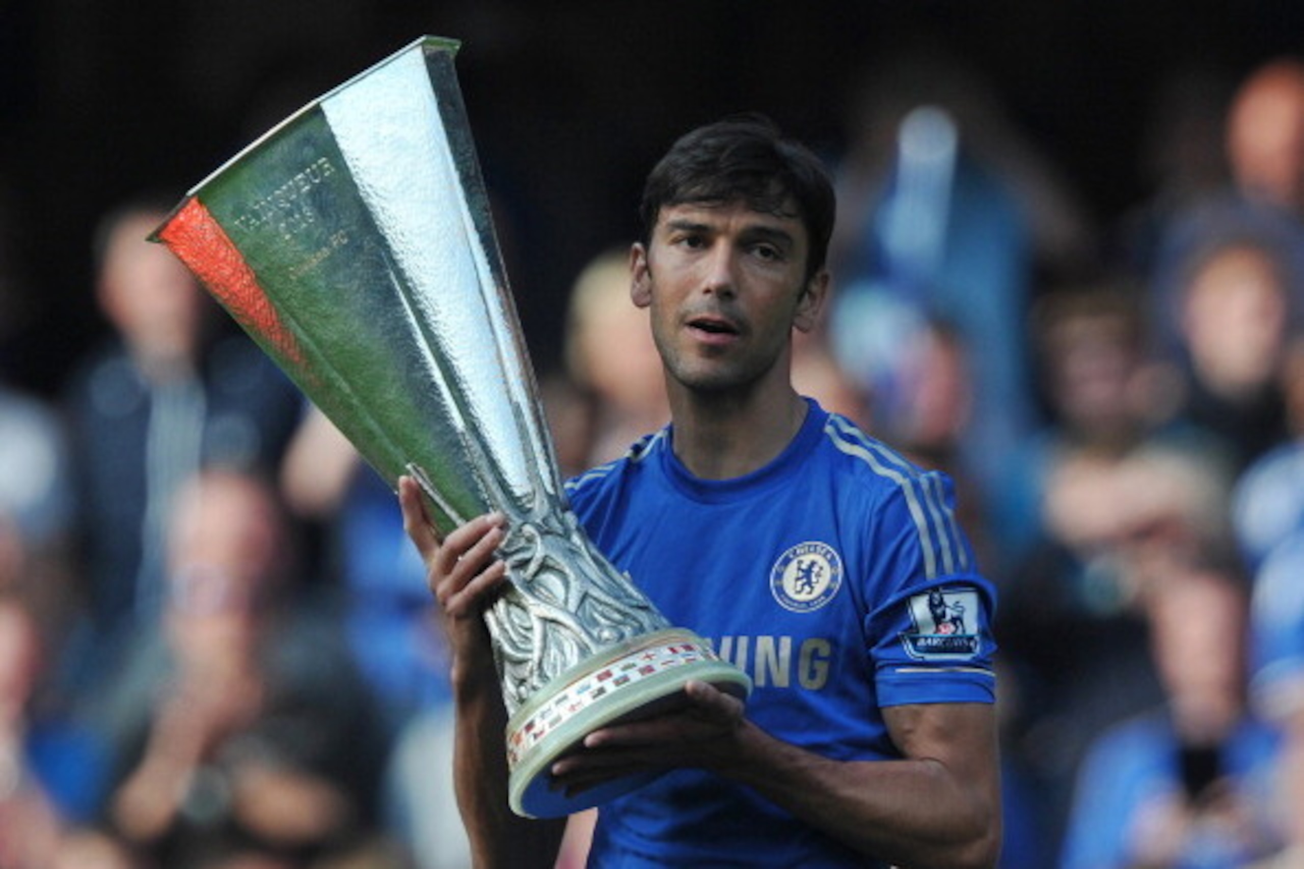 Chelsea's Portugese defender Paulo Ferreira holds the UEFA Europa League trophy at the end of the English Premier League football match between Chelsea and Everton at Stamford Bridge in London on May 19, 2013. Fernando Torres' second half winner confirmed