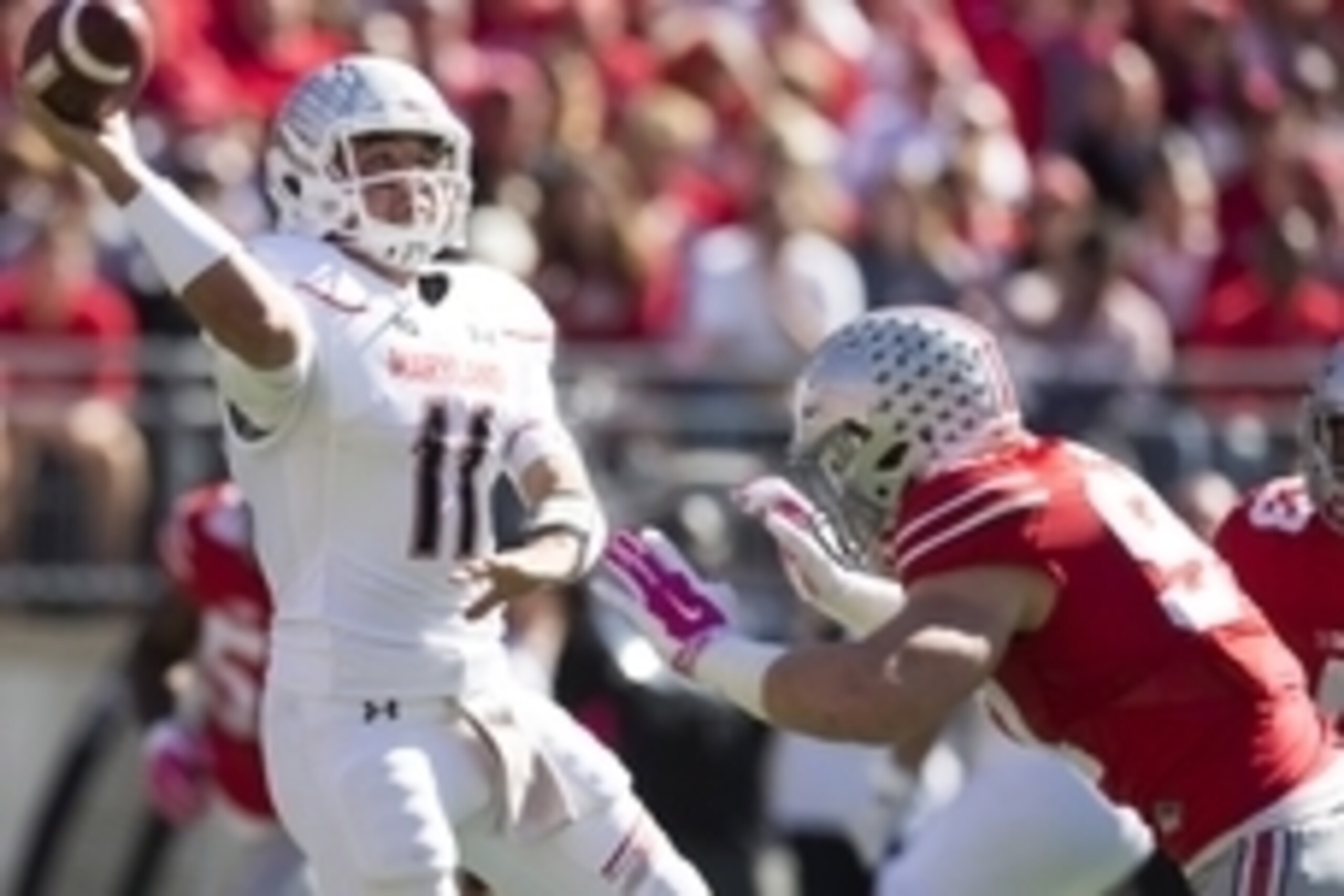 Oct 10, 2015; Columbus, OH, USA; Maryland Terrapins quarterback Perry Hills (11) tries to get a pass away ahead of pressure from Ohio State Buckeyes defensive lineman Joey Bosa (97) at Ohio Stadium. Mandatory Credit: Greg Bartram-USA TODAY Sports